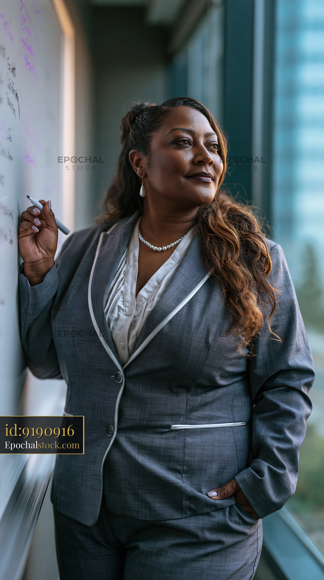 Plus Size Businesswoman in Tailored Suit Standing by Whiteboard - stock photo