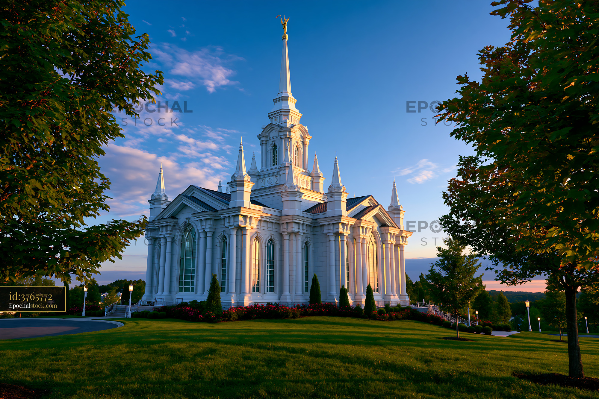 Watermarked full-resolution preview of Beautiful church structure at sunset with clear blue sky