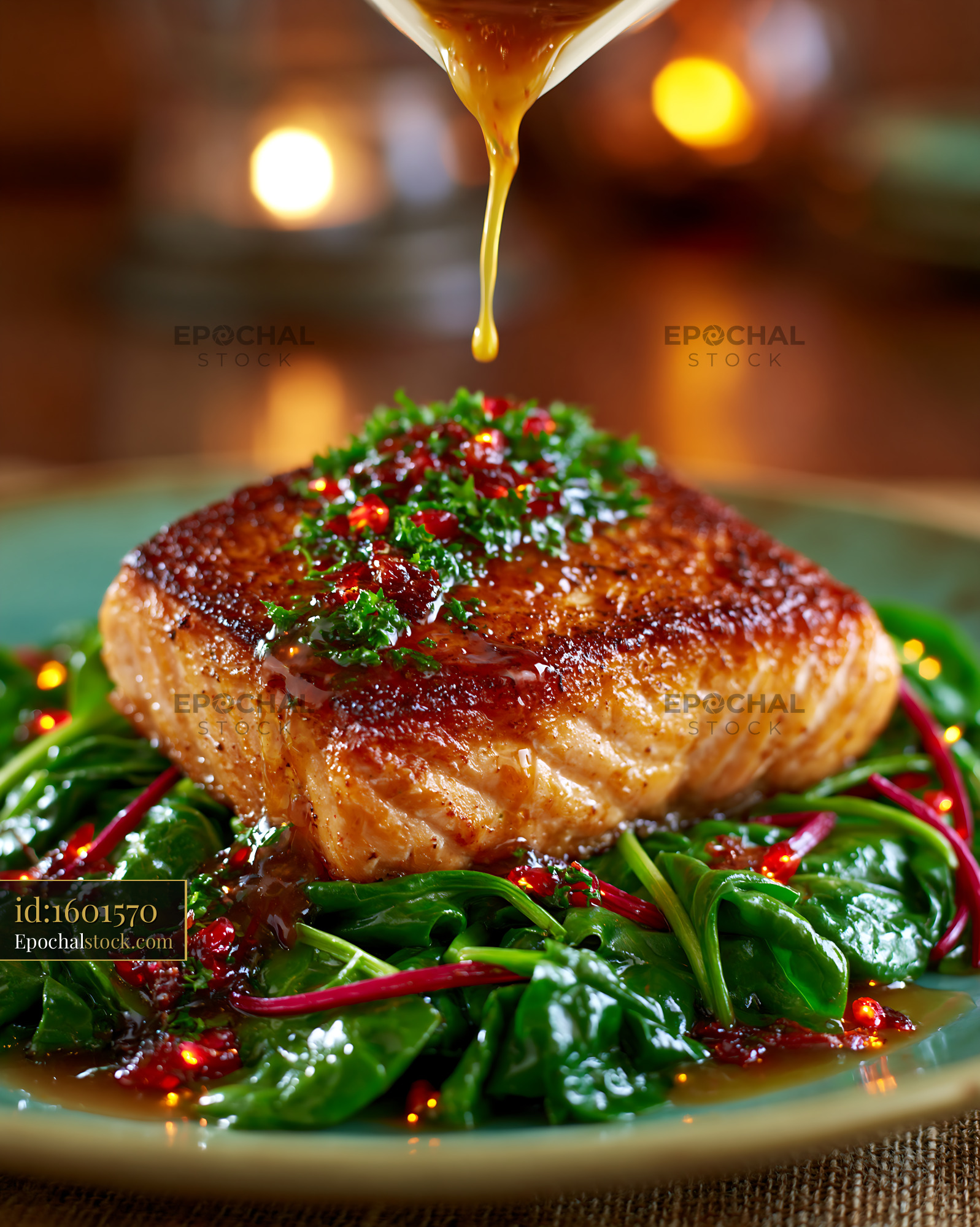 Watermarked full-resolution preview of Cooking salmon with greens and sauce in a restaurant setting