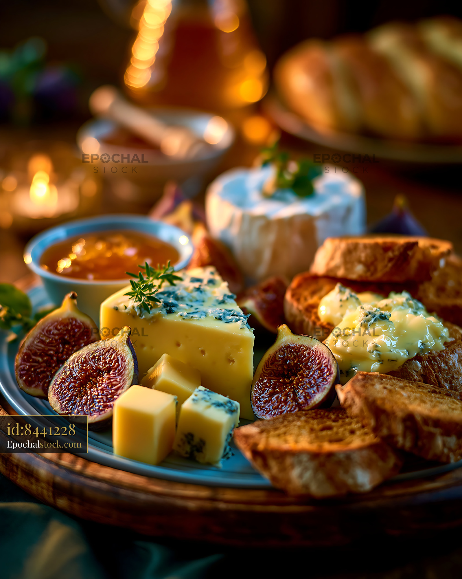 Watermarked full-resolution preview of Cheese and bread platter with figs and jam on wooden table