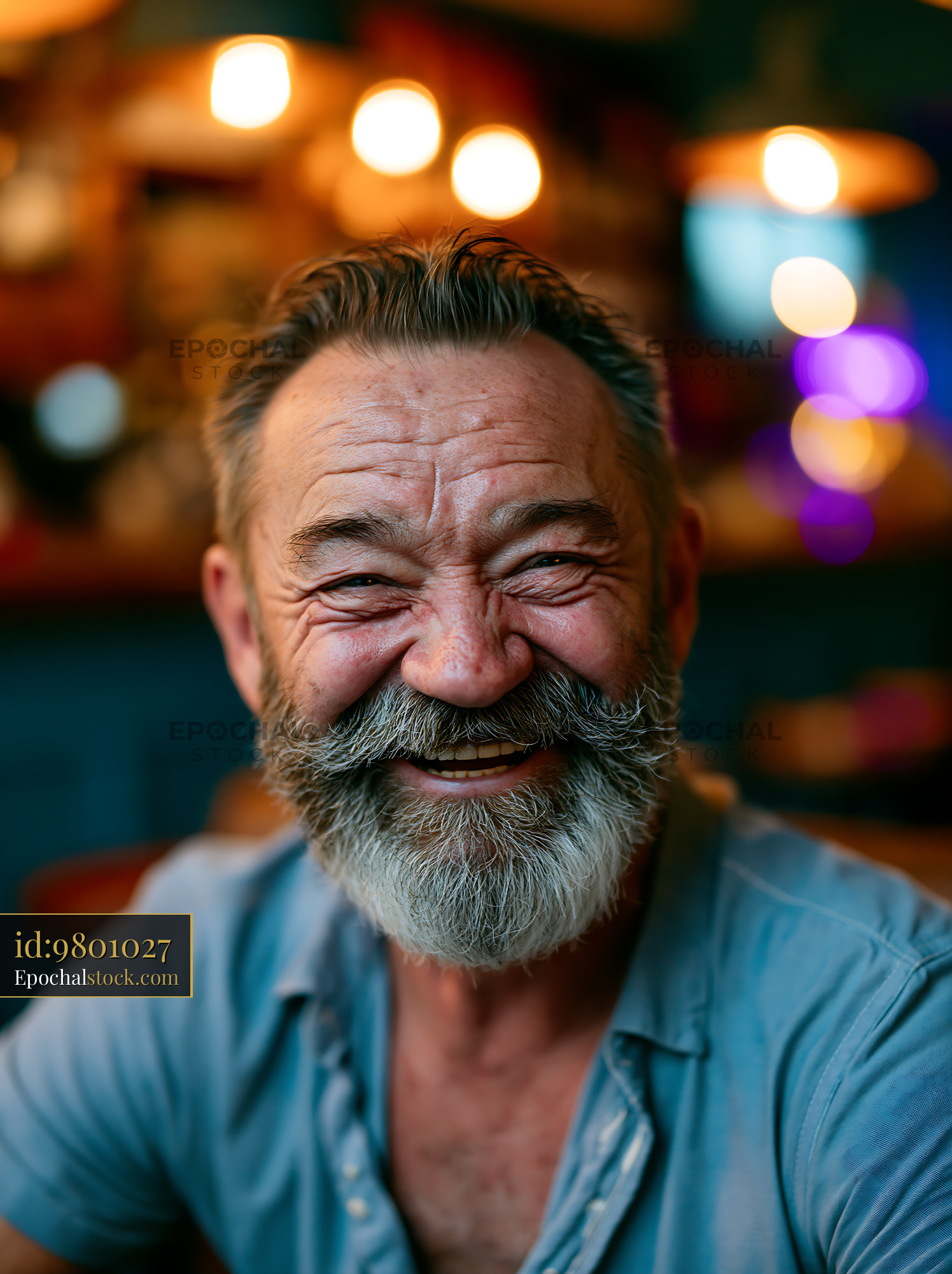 Watermarked full-resolution preview of Smiling man with beard in casual setting