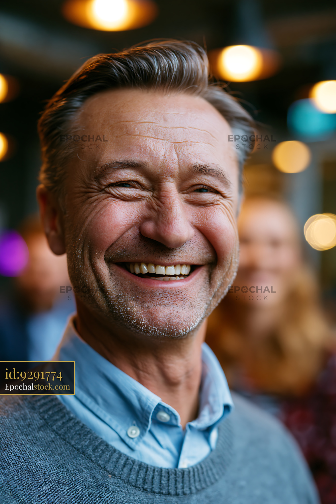 Watermarked full-resolution preview of Smiling older man at a social gathering
