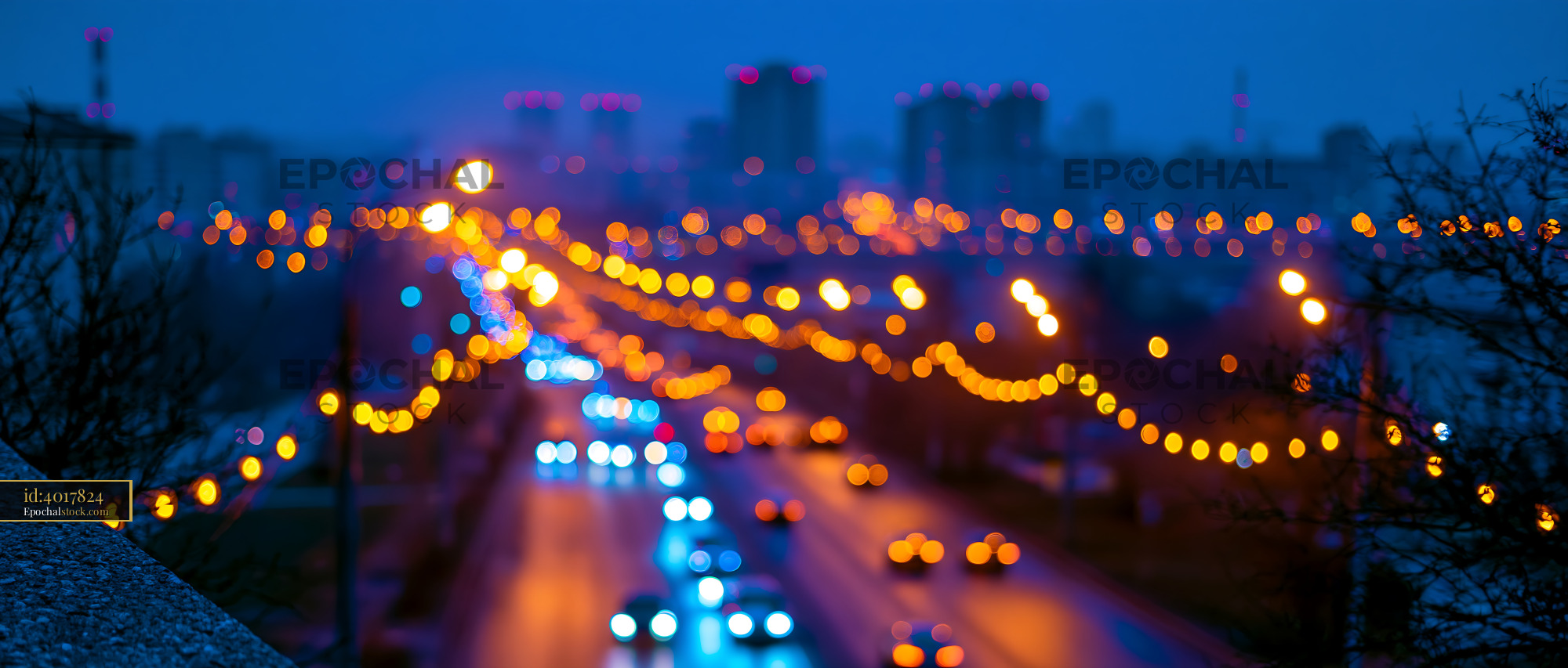Watermarked full-resolution preview of City lights at dusk with blurred traffic in the foreground