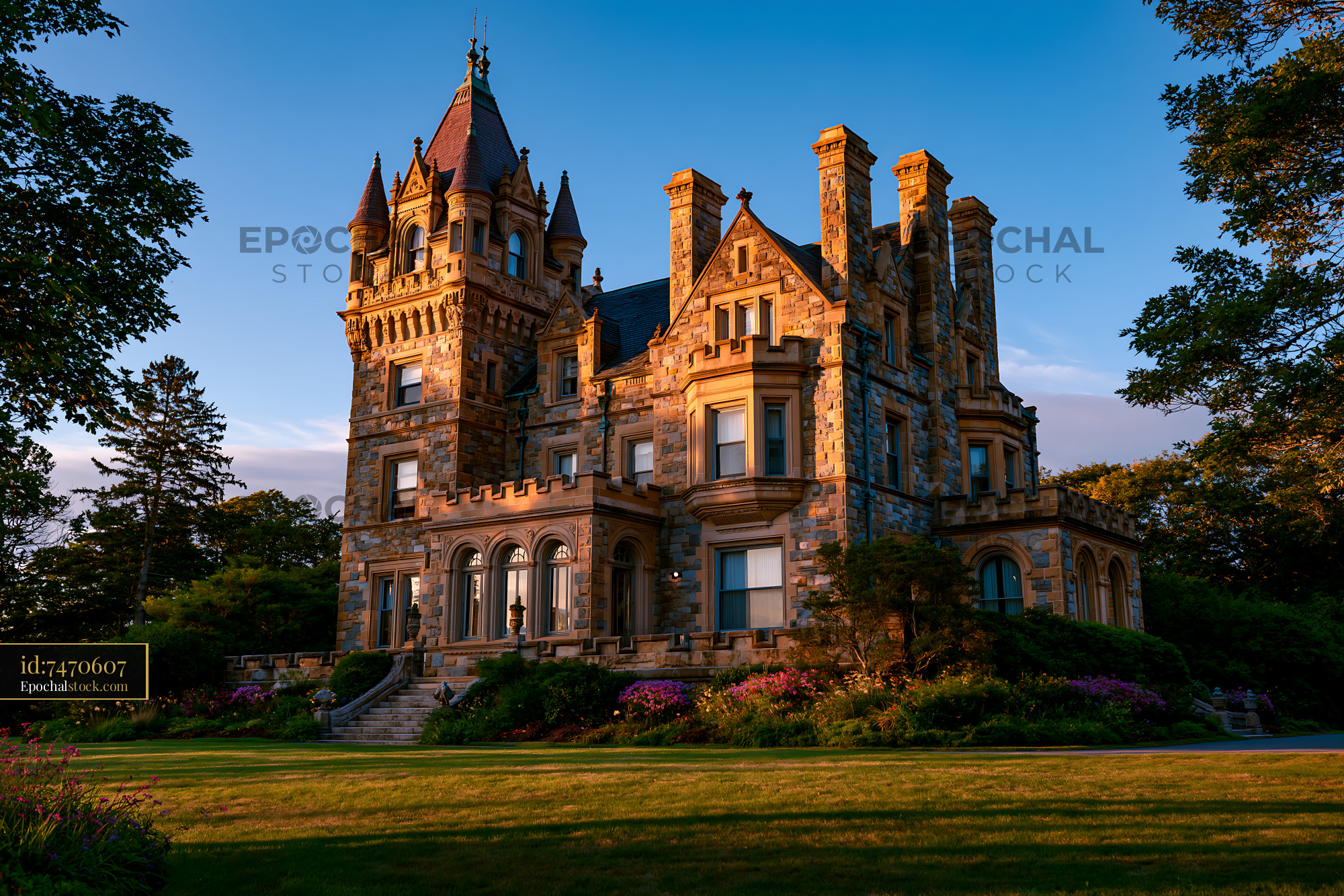 Watermarked full-resolution preview of Historic mansion surrounded by trees and gardens at sunset