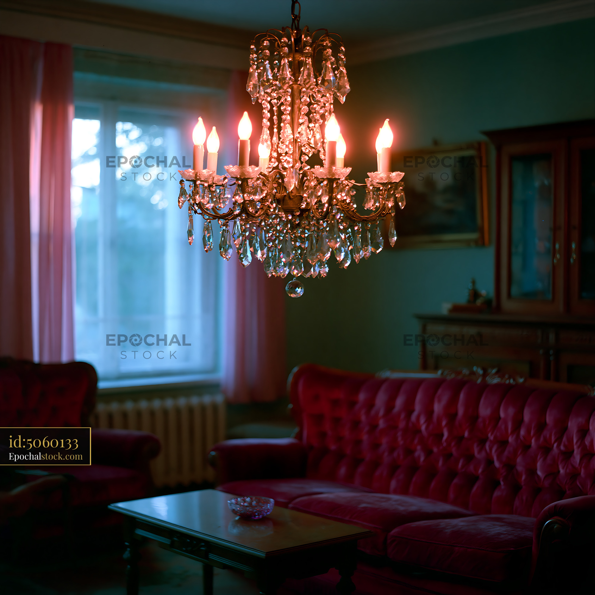 Watermarked full-resolution preview of Chandelier hanging in a vintage living room with red sofa