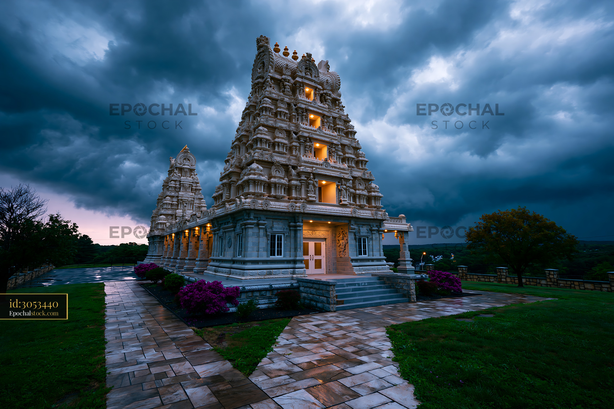 Watermarked full-resolution preview of Historic temple under dark stormy sky during twilight