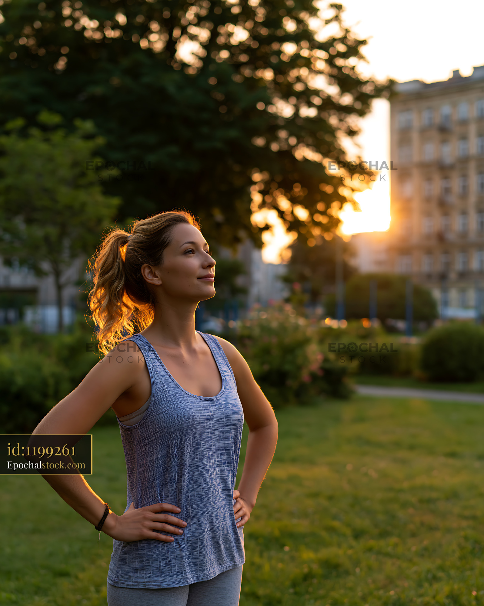 Woman Enjoying Sunset in Park During Outdoor Workout Session - stock photo
