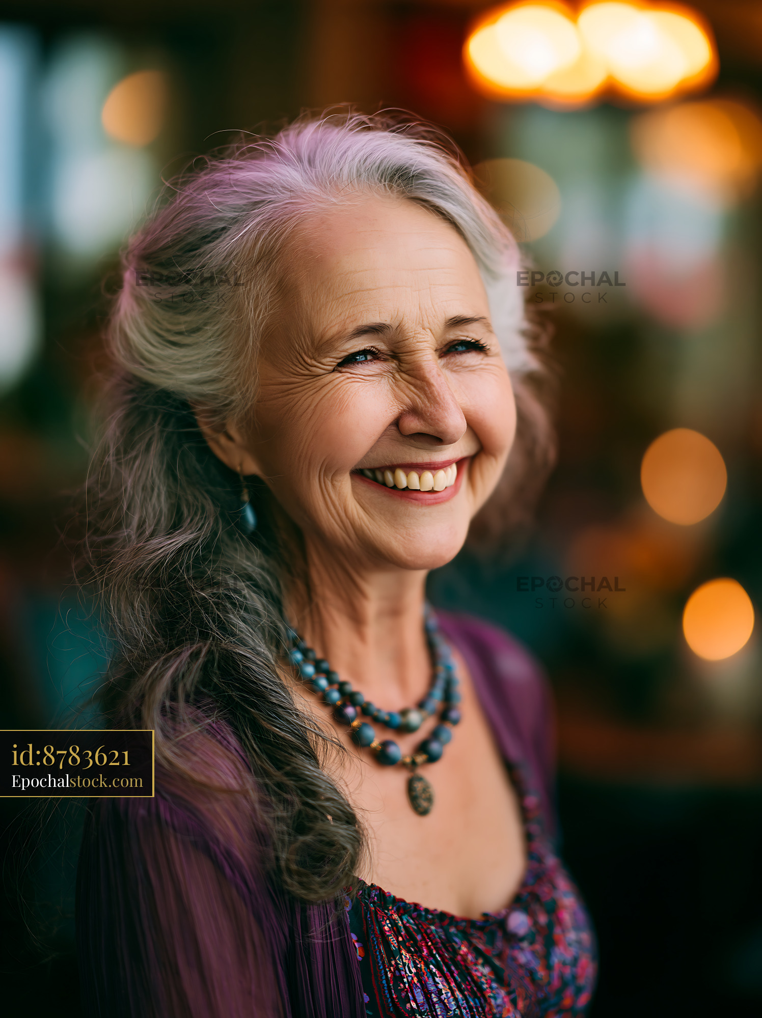 Watermarked full-resolution preview of Smiling woman with silver hair in a colorful setting