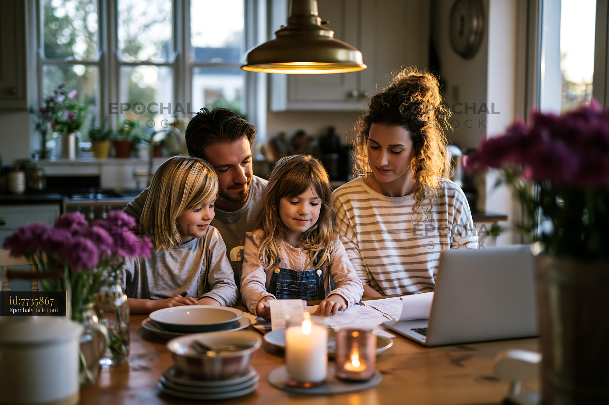 Family Discussing Insurance Offers at a Kitchen Table During Sunset - stock photo