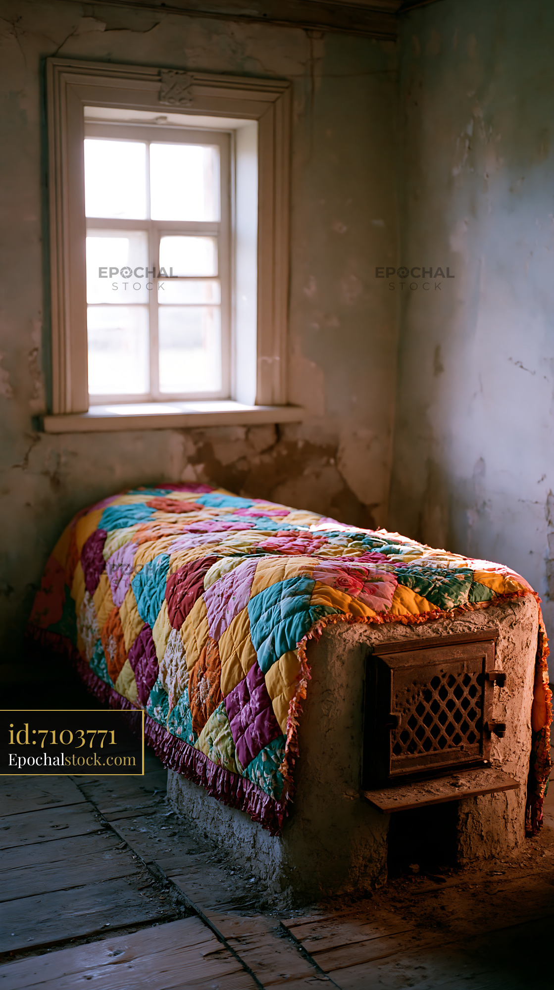 Watermarked full-resolution preview of Colorful quilt on a bed by a window in an old room
