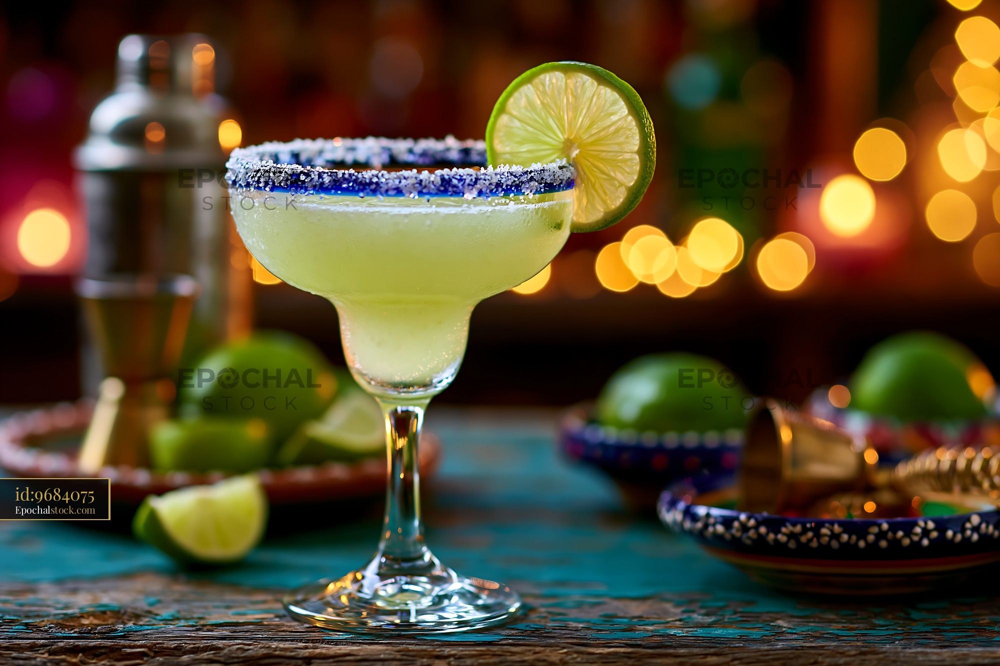 Watermarked full-resolution preview of Refreshing margarita drink with lime on a wooden table