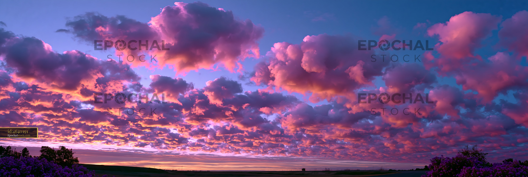 Watermarked full-resolution preview of Colorful sunset sky above countryside horizon