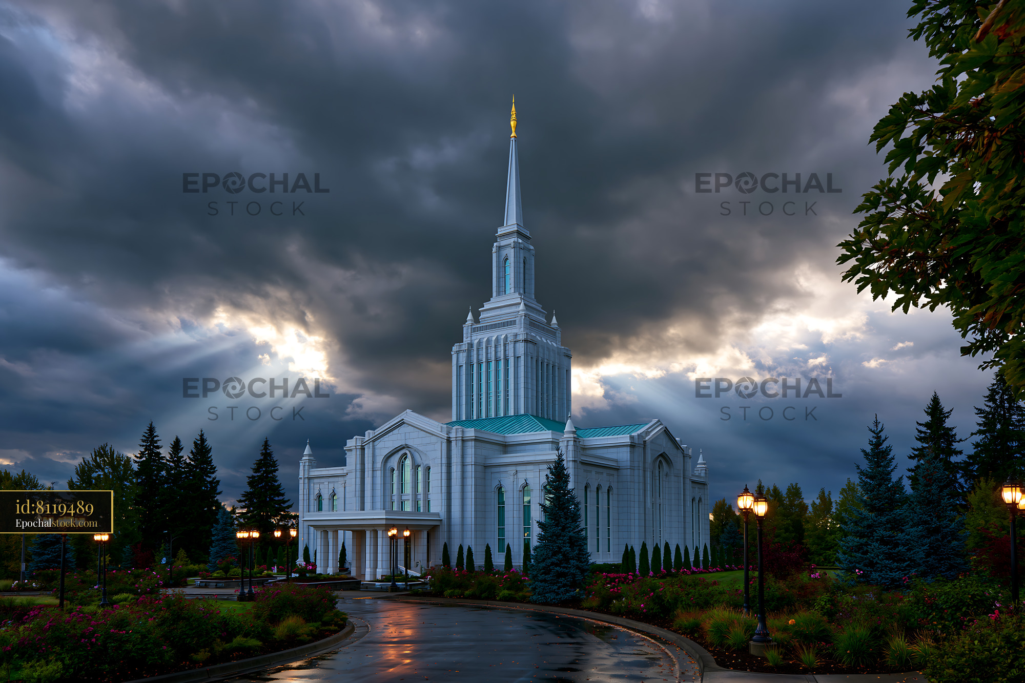 Watermarked full-resolution preview of Cloudy sky over a tall white building with a spire and garden