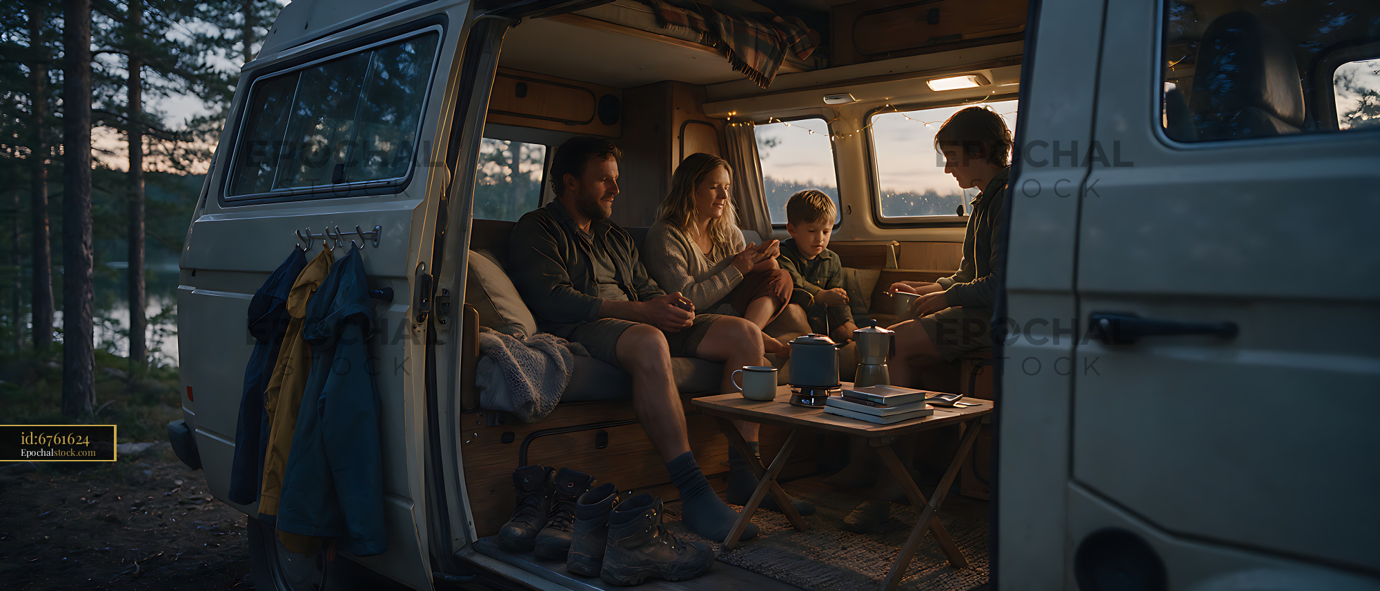 Watermarked full-resolution preview of Family spending time together in a camper van among trees