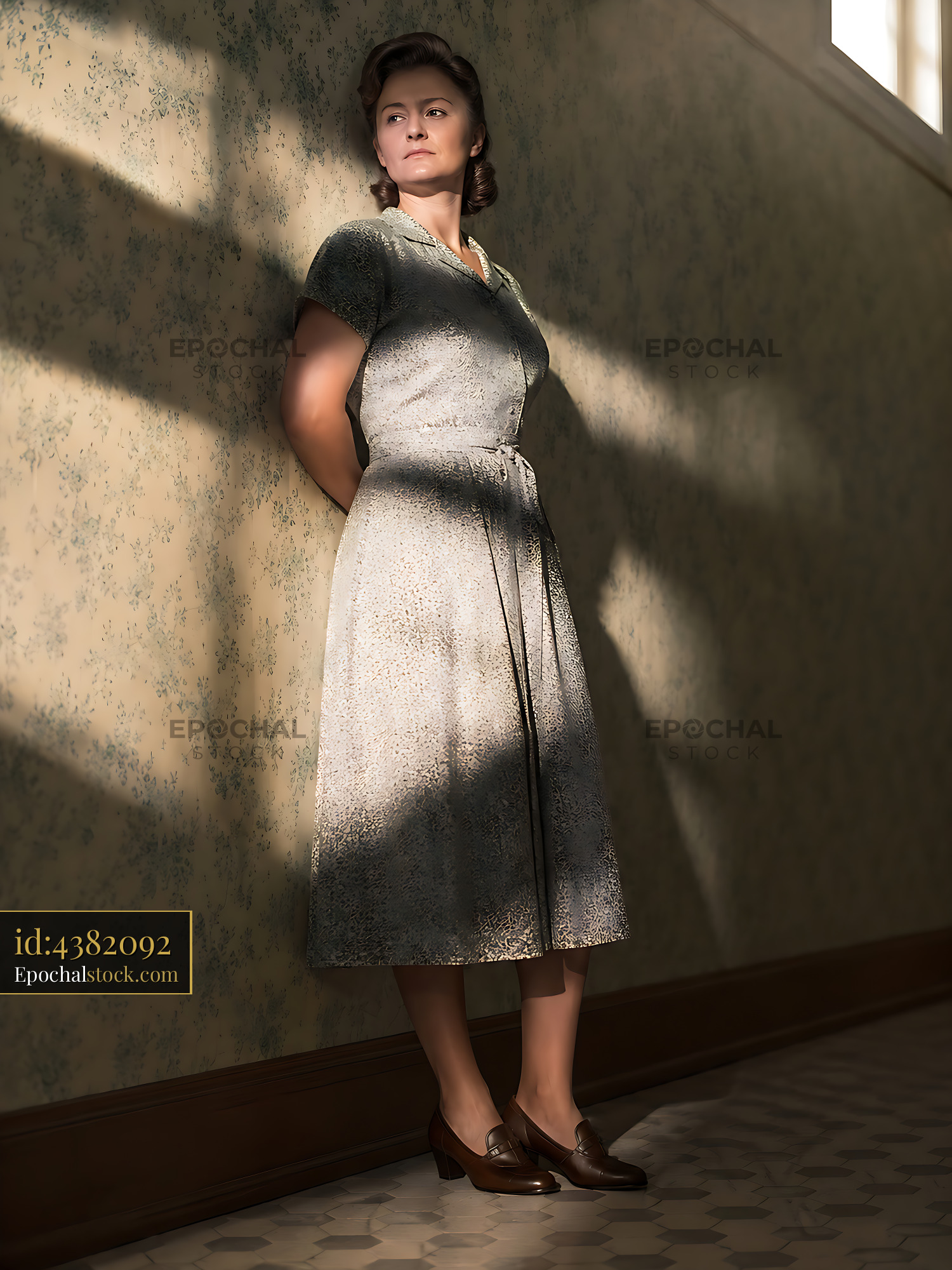 Watermarked full-resolution preview of Woman in a vintage dress standing in a sunlit hallway