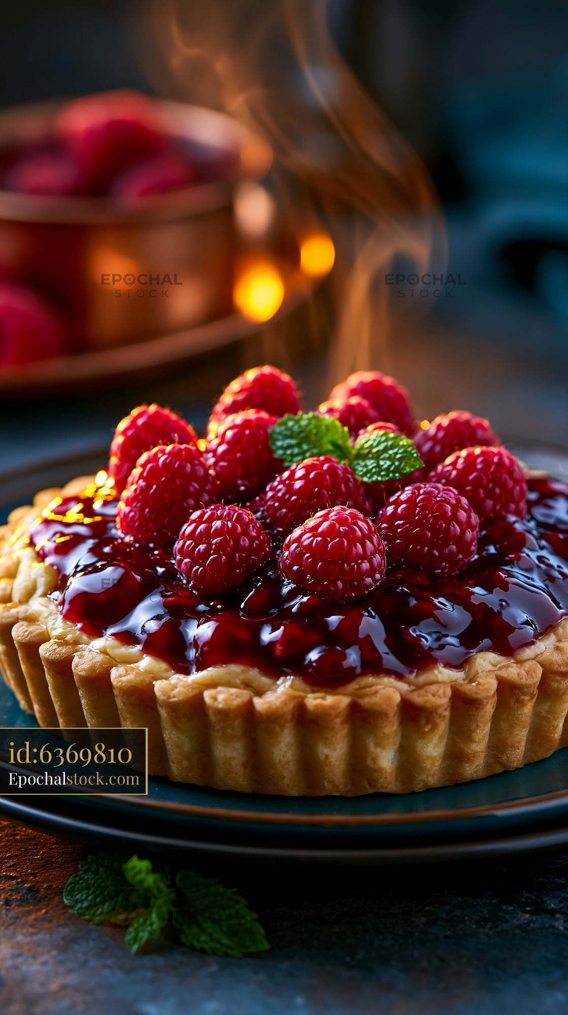 Watermarked full-resolution preview of Raspberry tart with fresh berries and glossy glaze on a table