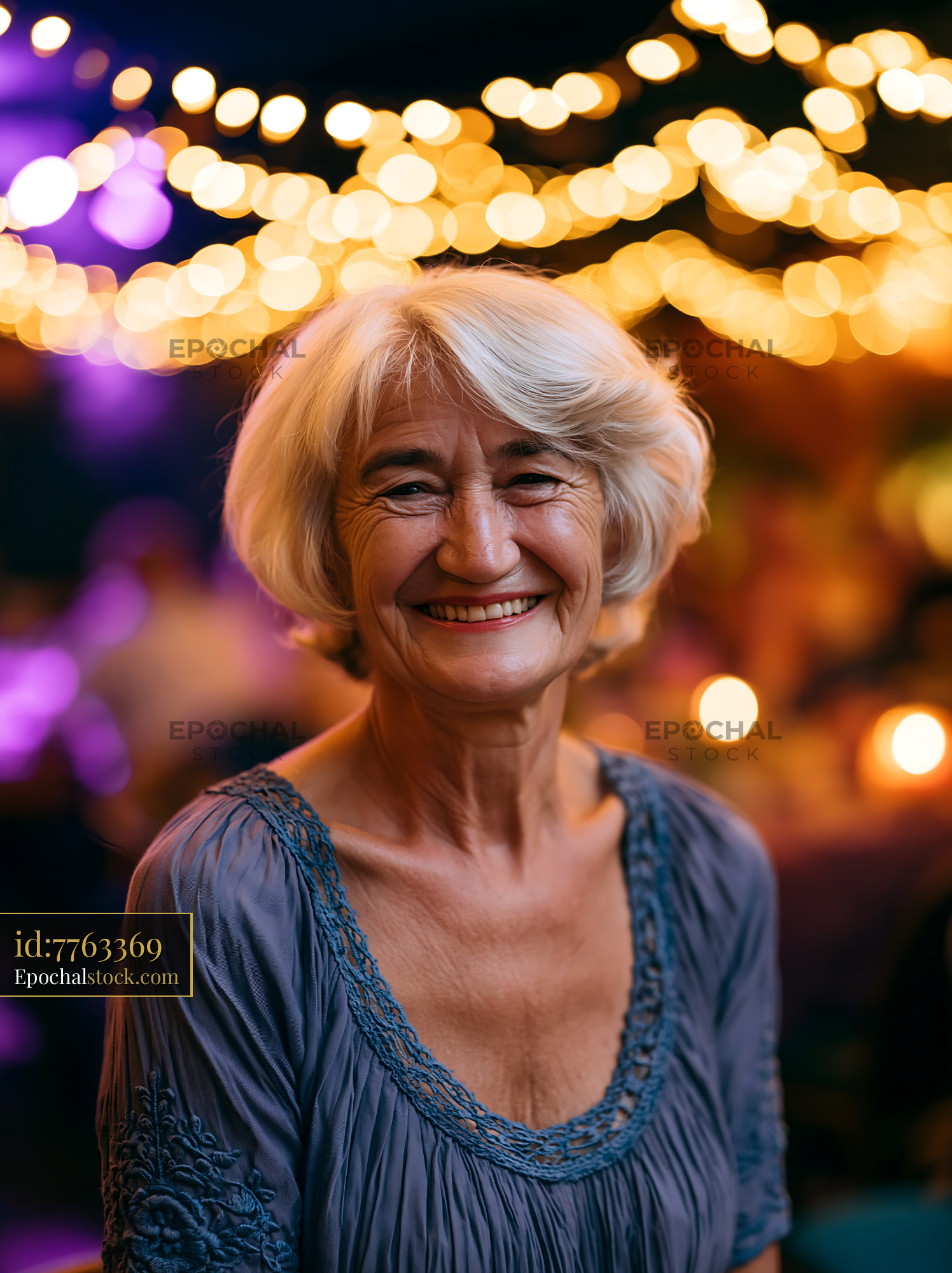 Watermarked full-resolution preview of Smiling woman with gray hair in a festive setting