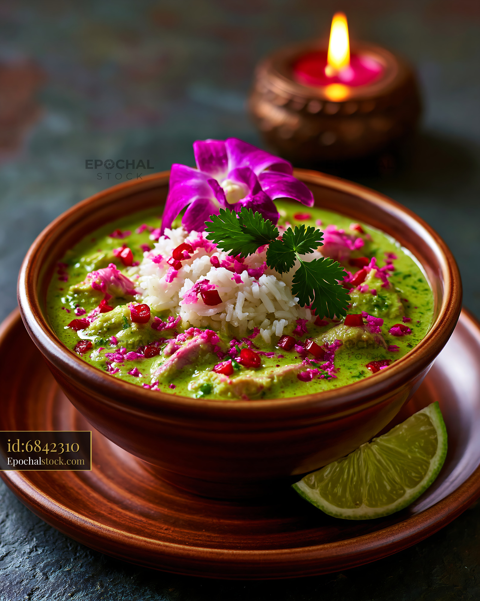 Watermarked full-resolution preview of Healthy green curry with rice and garnish served in a bowl