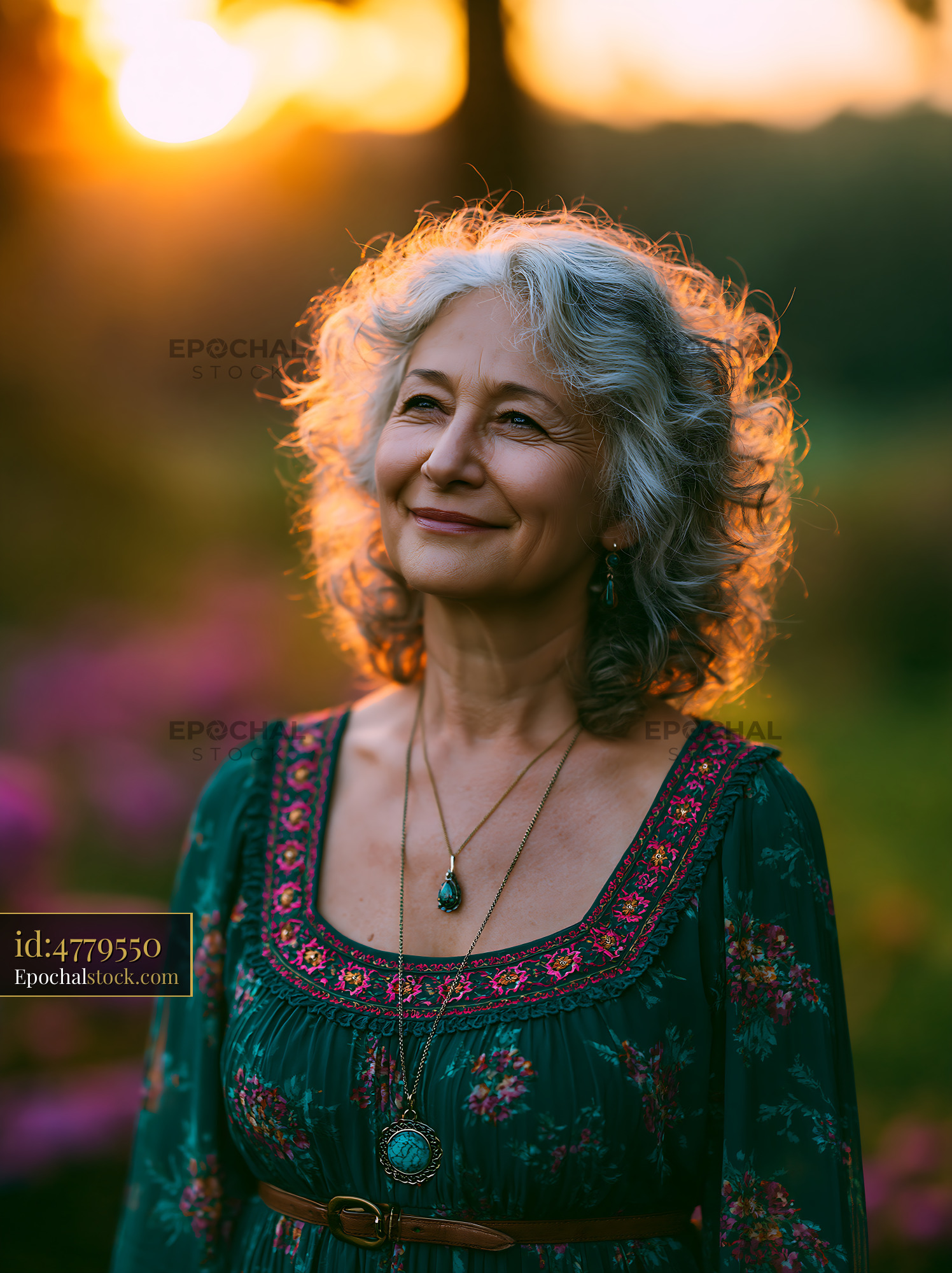 Watermarked full-resolution preview of Woman smiling during sunset in a floral dress