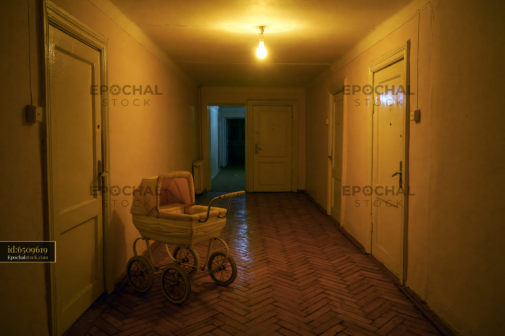 Watermarked full-resolution preview of Empty hallway with a vintage baby carriage during low light