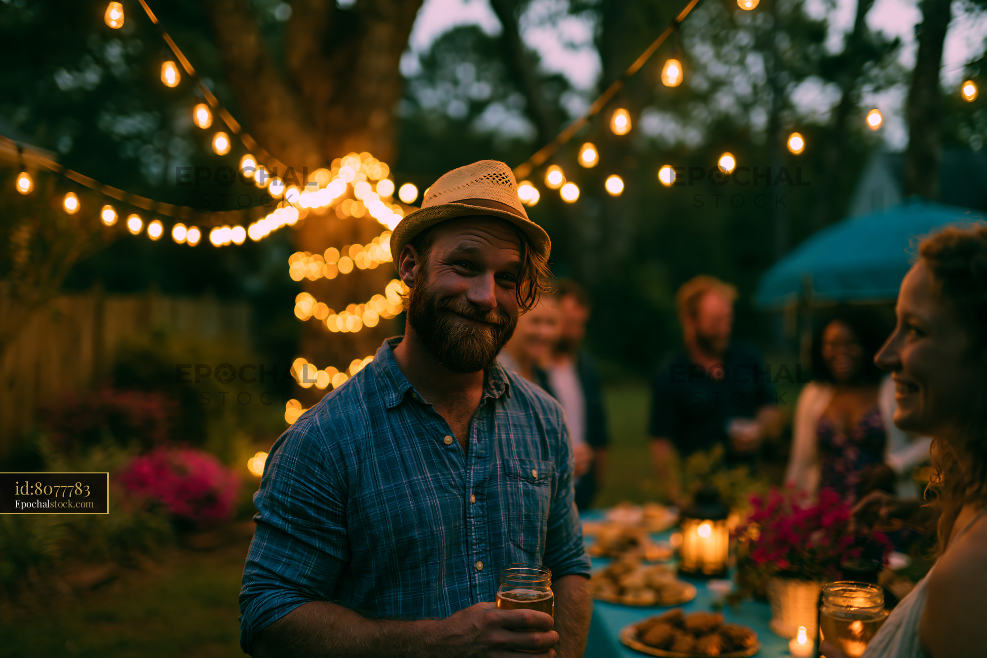 Watermarked full-resolution preview of Gathering in the garden during evening with lights and food