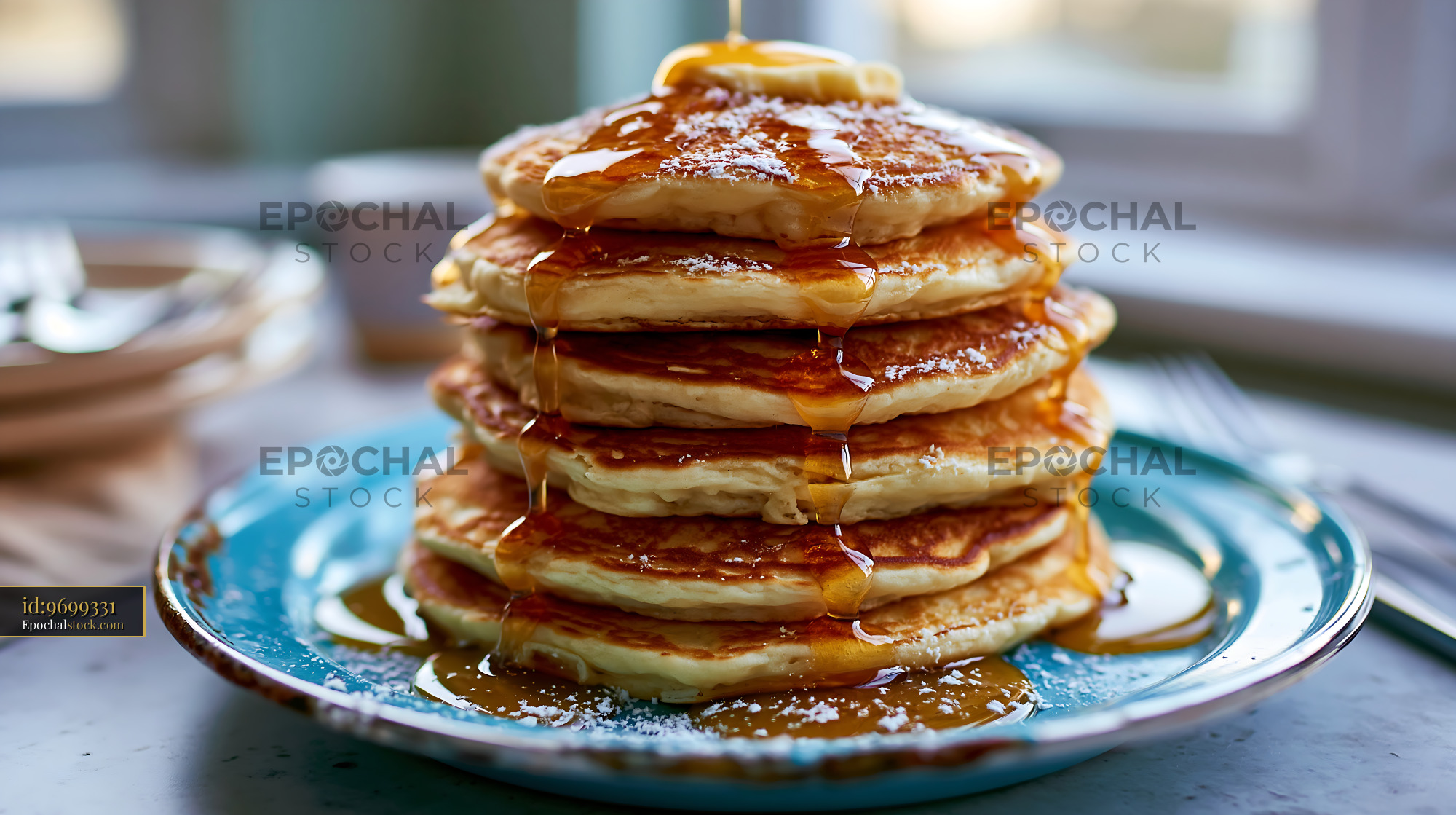 Watermarked full-resolution preview of Stack of pancakes with syrup on a blue plate