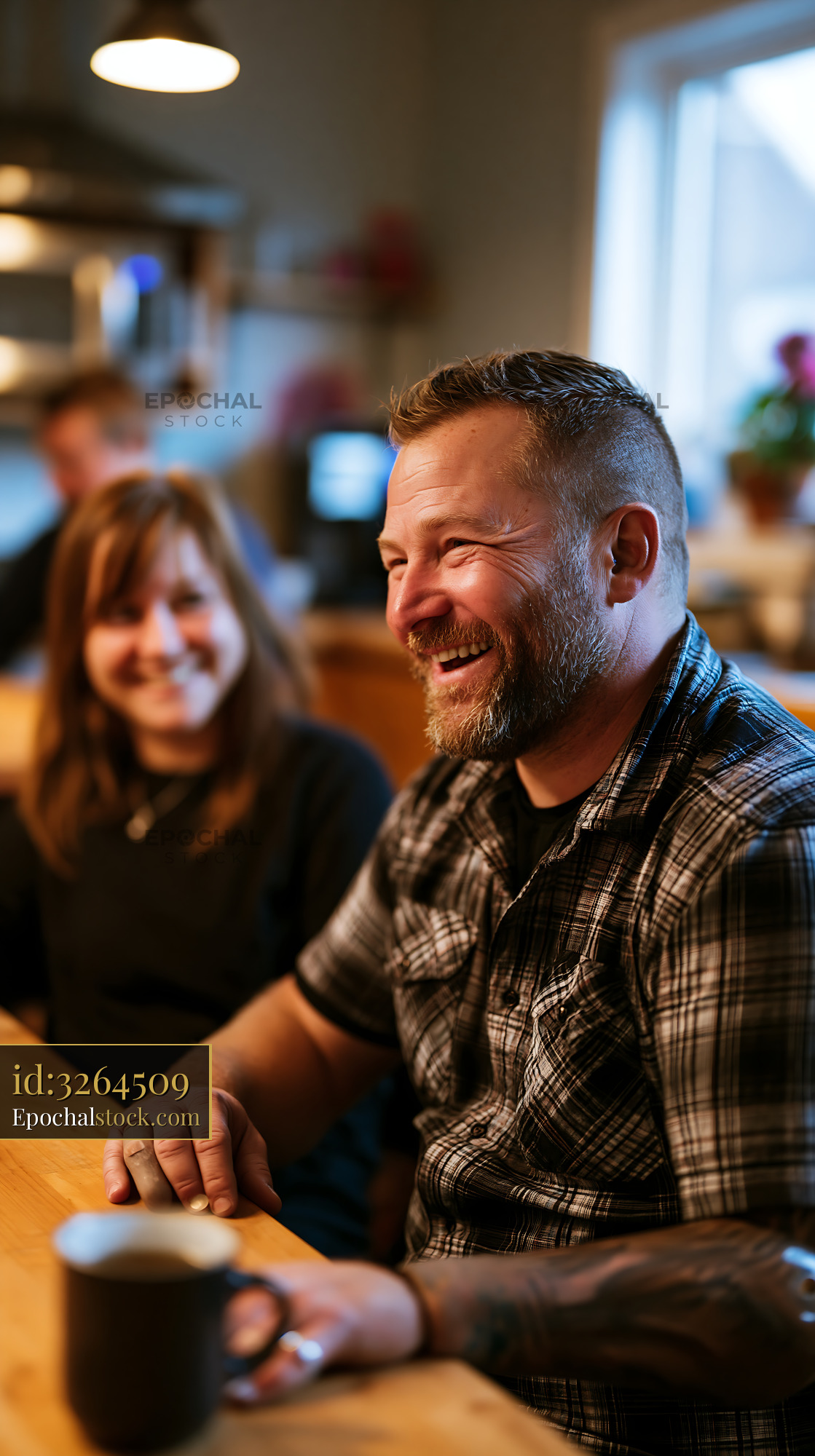 Watermarked full-resolution preview of Group of friends enjoying conversation in a cozy cafe setting
