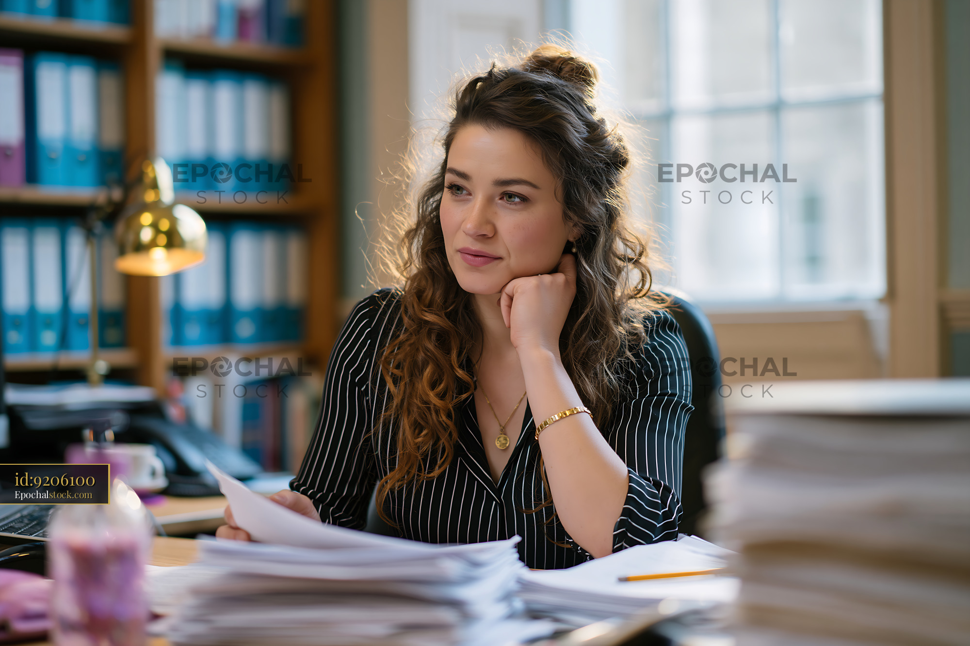 Manager Coordinating Tasks in Office With Papers and Documents - stock photo