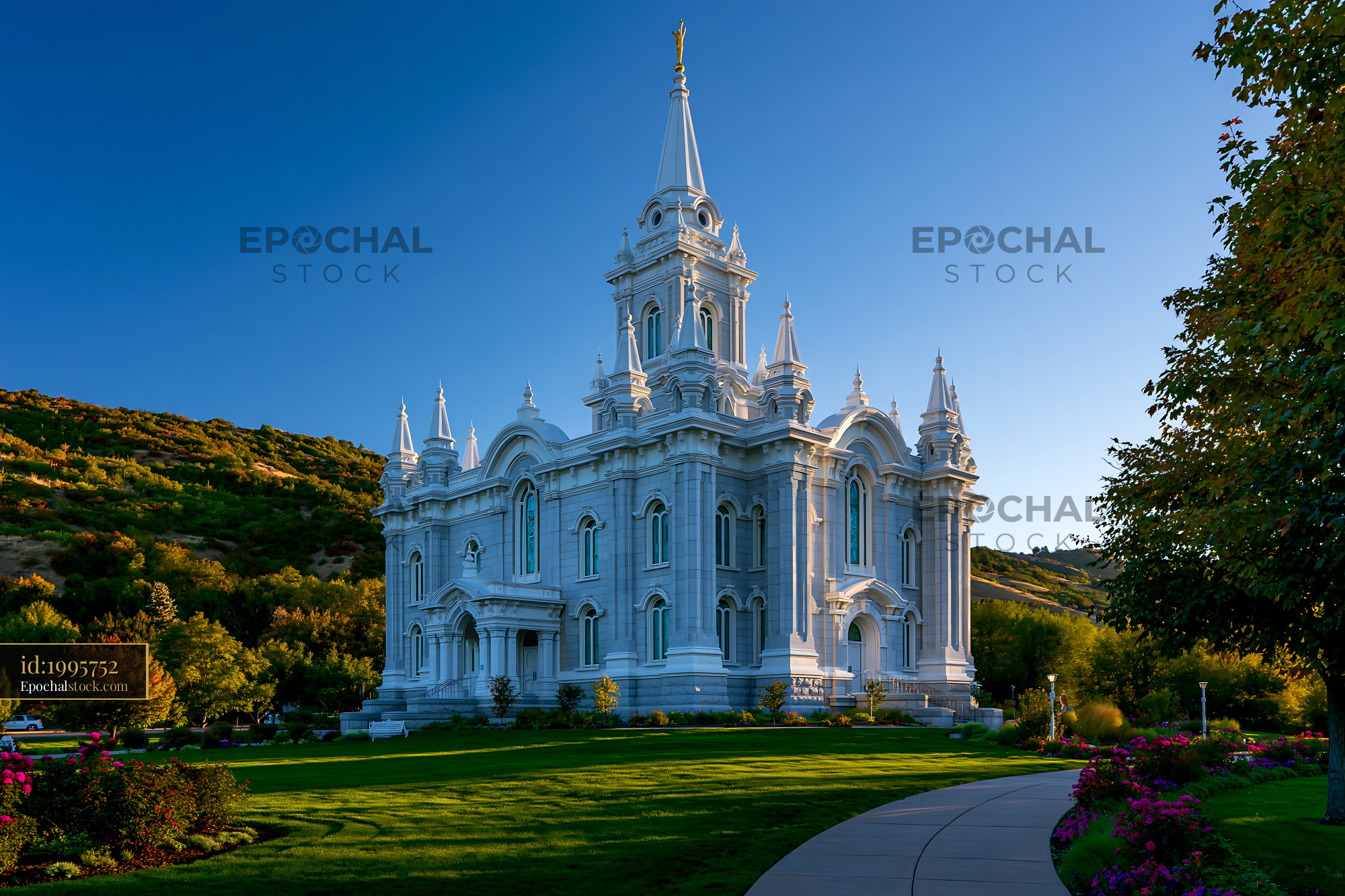 Watermarked full-resolution preview of White church building surrounded by green grass and trees