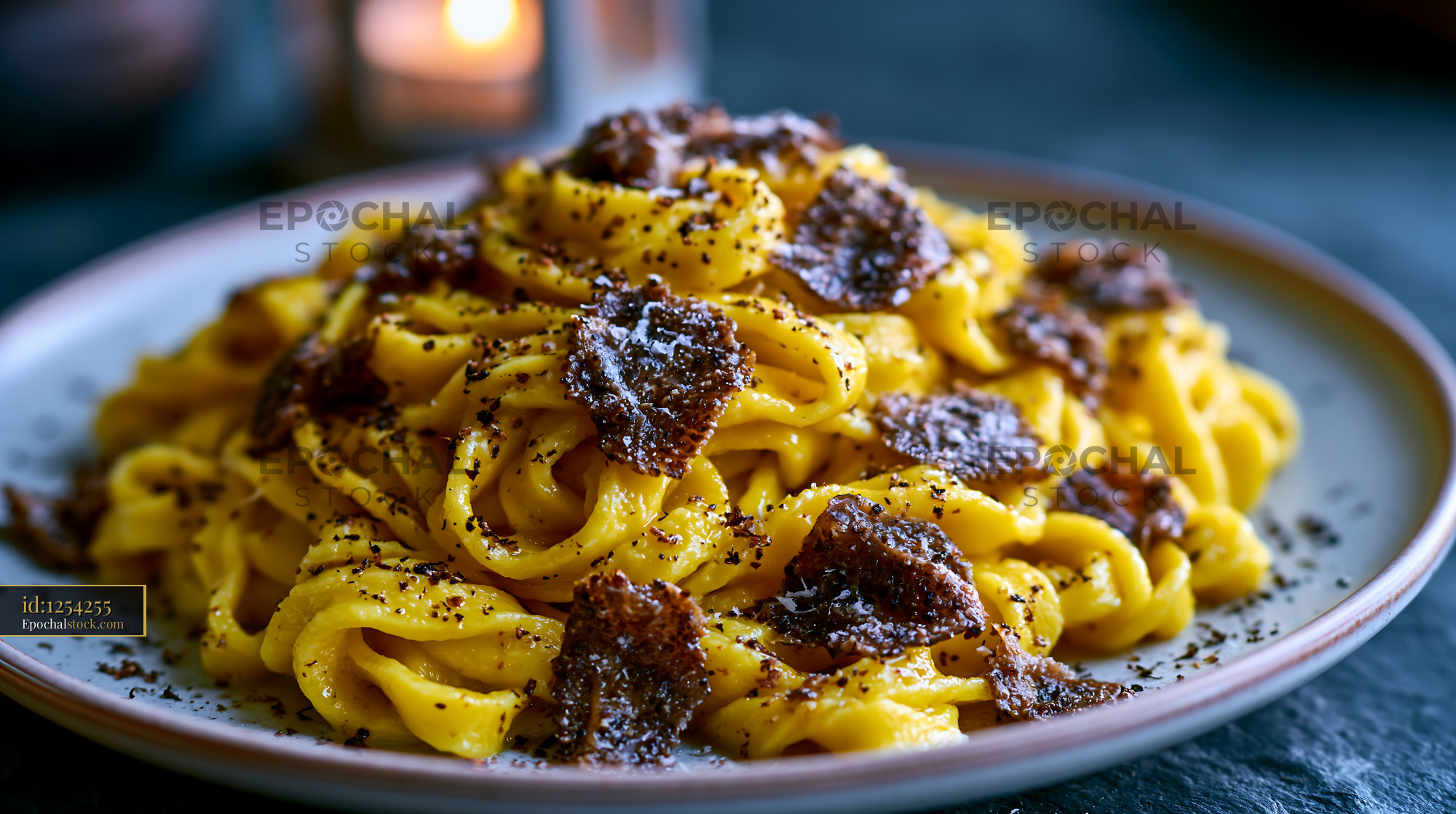 Watermarked full-resolution preview of Pasta topped with black truffle and grated cheese