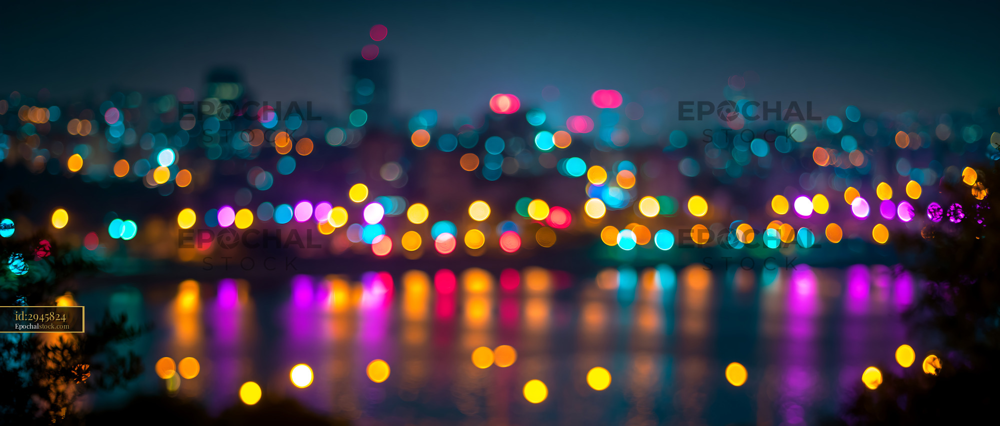 Watermarked full-resolution preview of City skyline with blurred lights reflecting on water