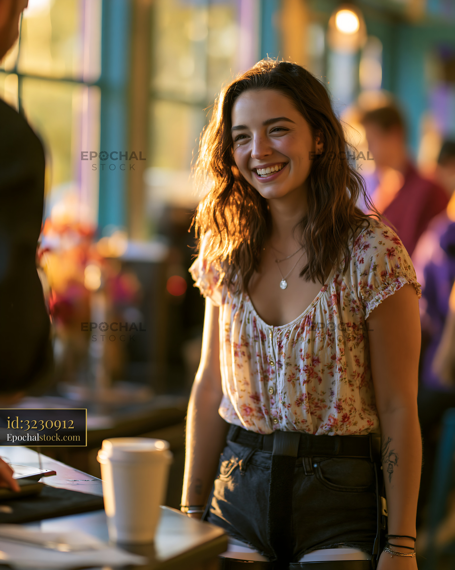 Watermarked full-resolution preview of Woman smiling in a coffee shop during daytime