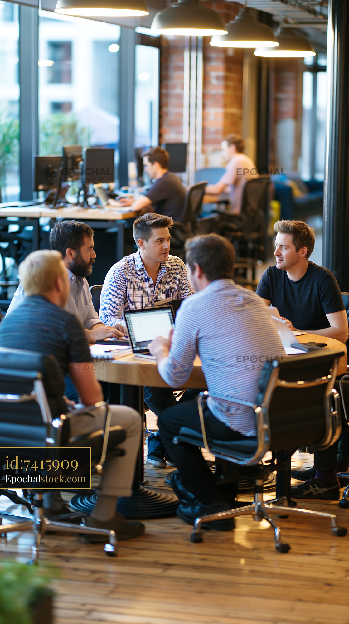 Watermarked full-resolution preview of Group of people in a modern office discussing plans