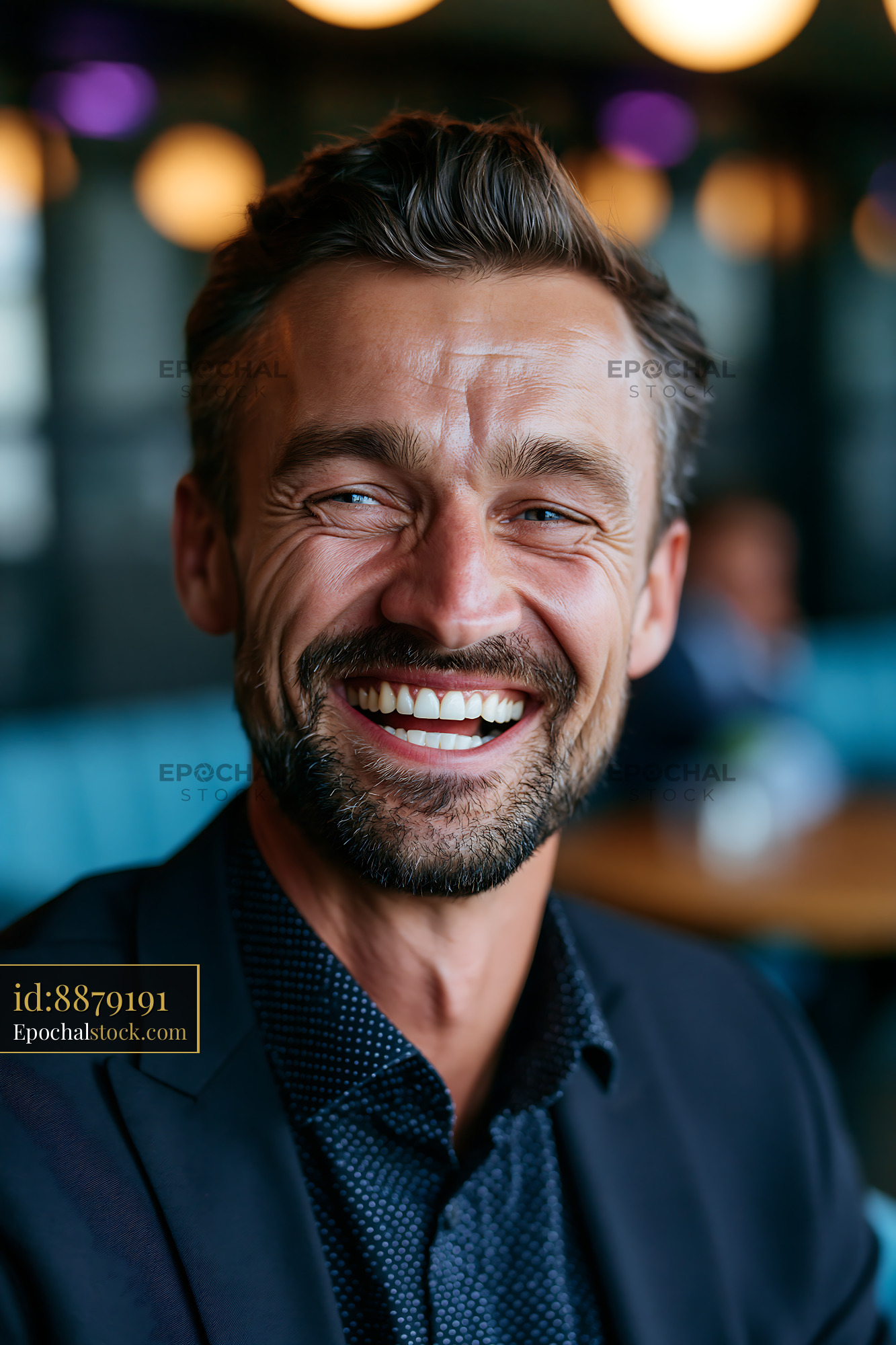 Watermarked full-resolution preview of Man smiling in urban cafe setting with modern decor