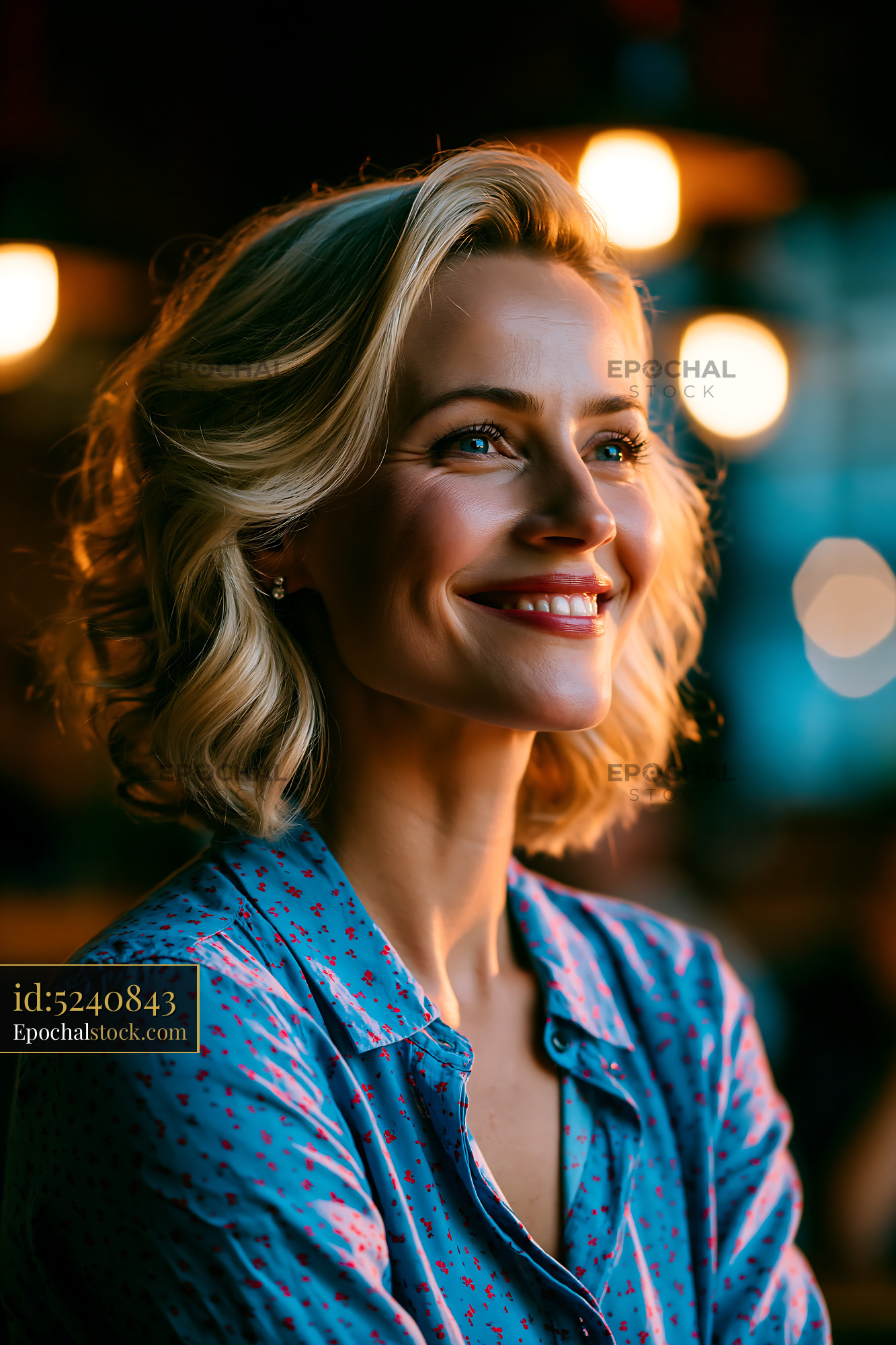 Watermarked full-resolution preview of Smiling woman with blonde hair in a cozy cafe setting