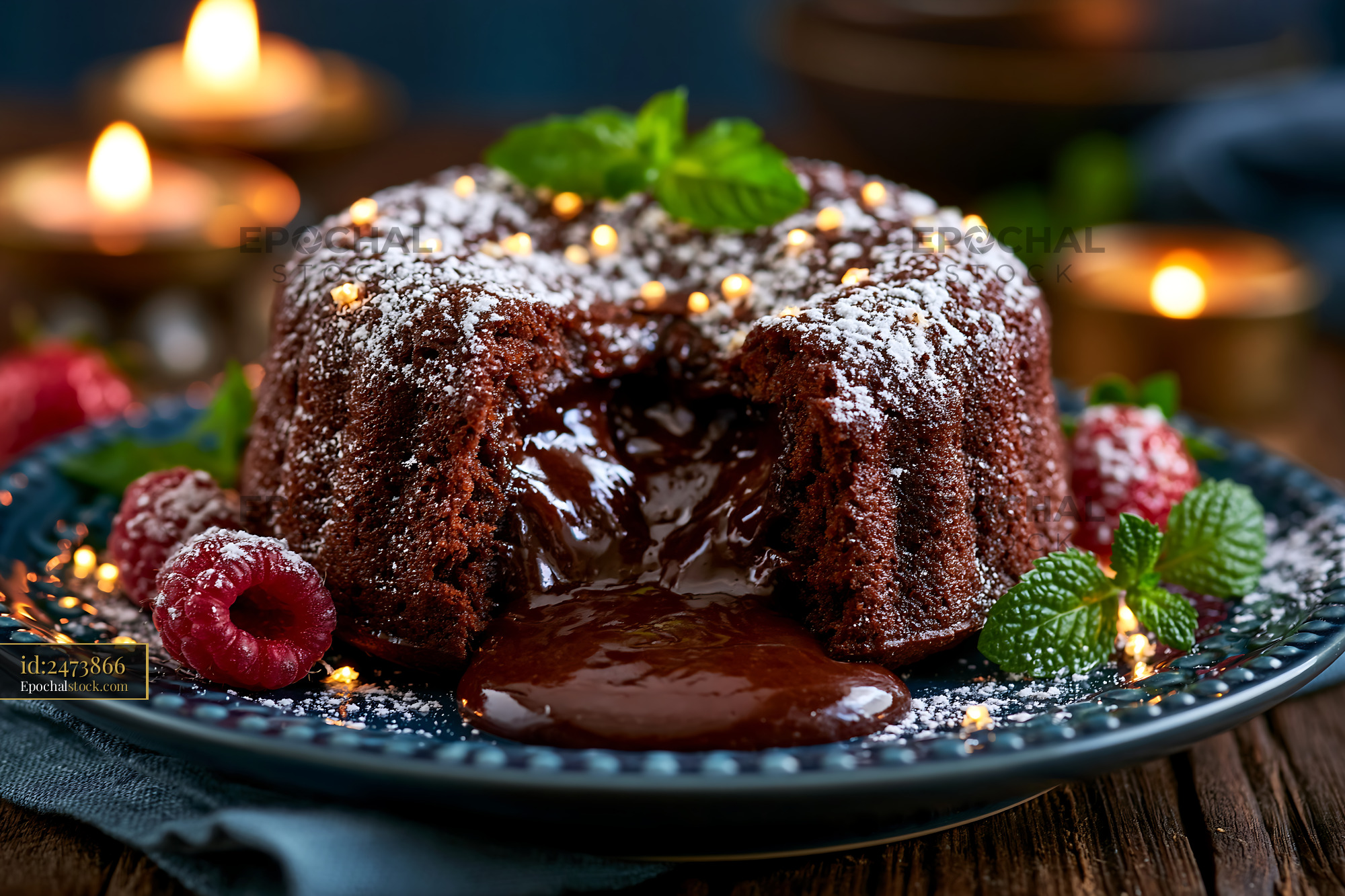 Watermarked full-resolution preview of Chocolate cake dessert with melting filling on a dark plate