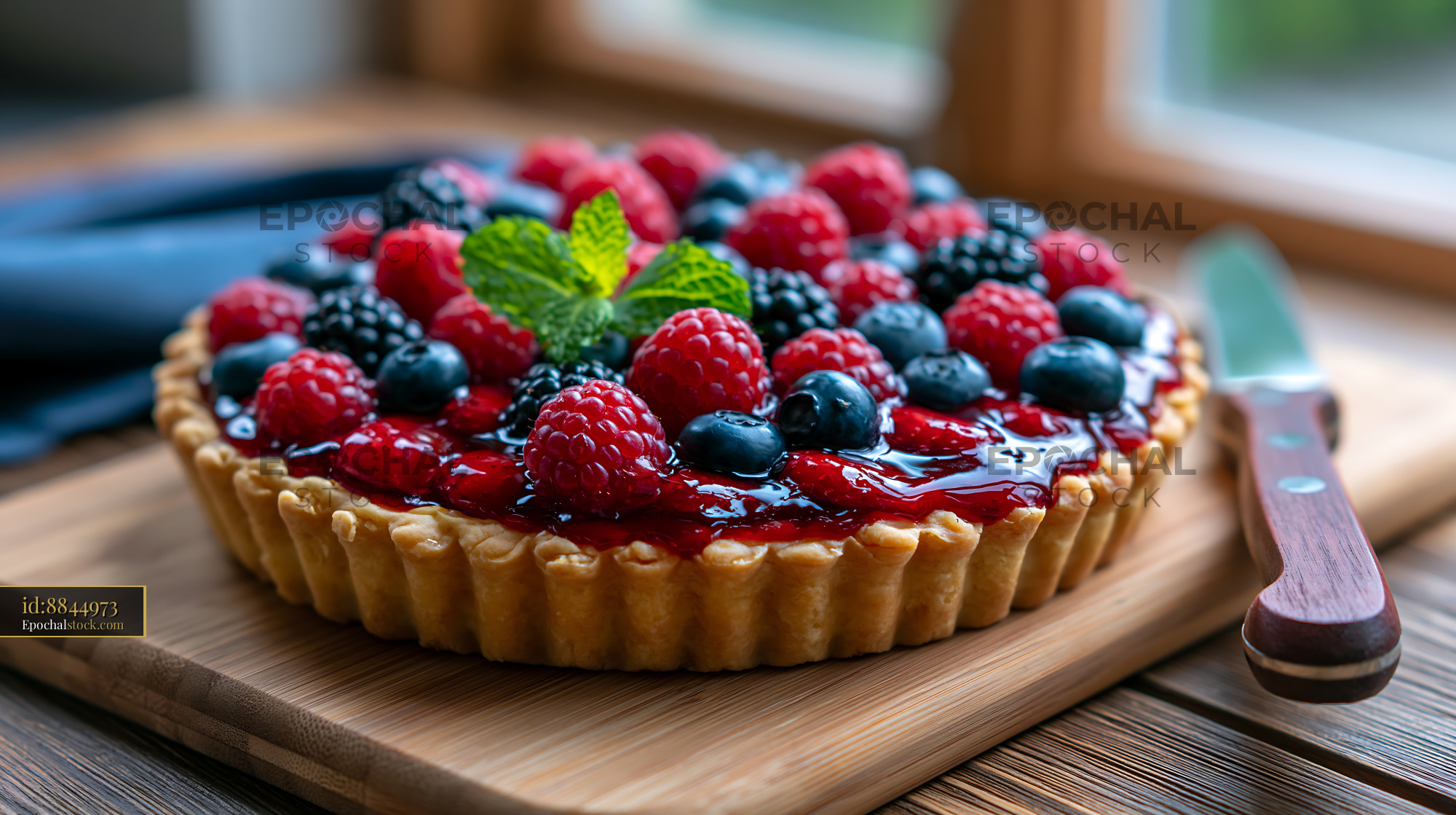 Watermarked full-resolution preview of Berry tart on a wooden table near a window
