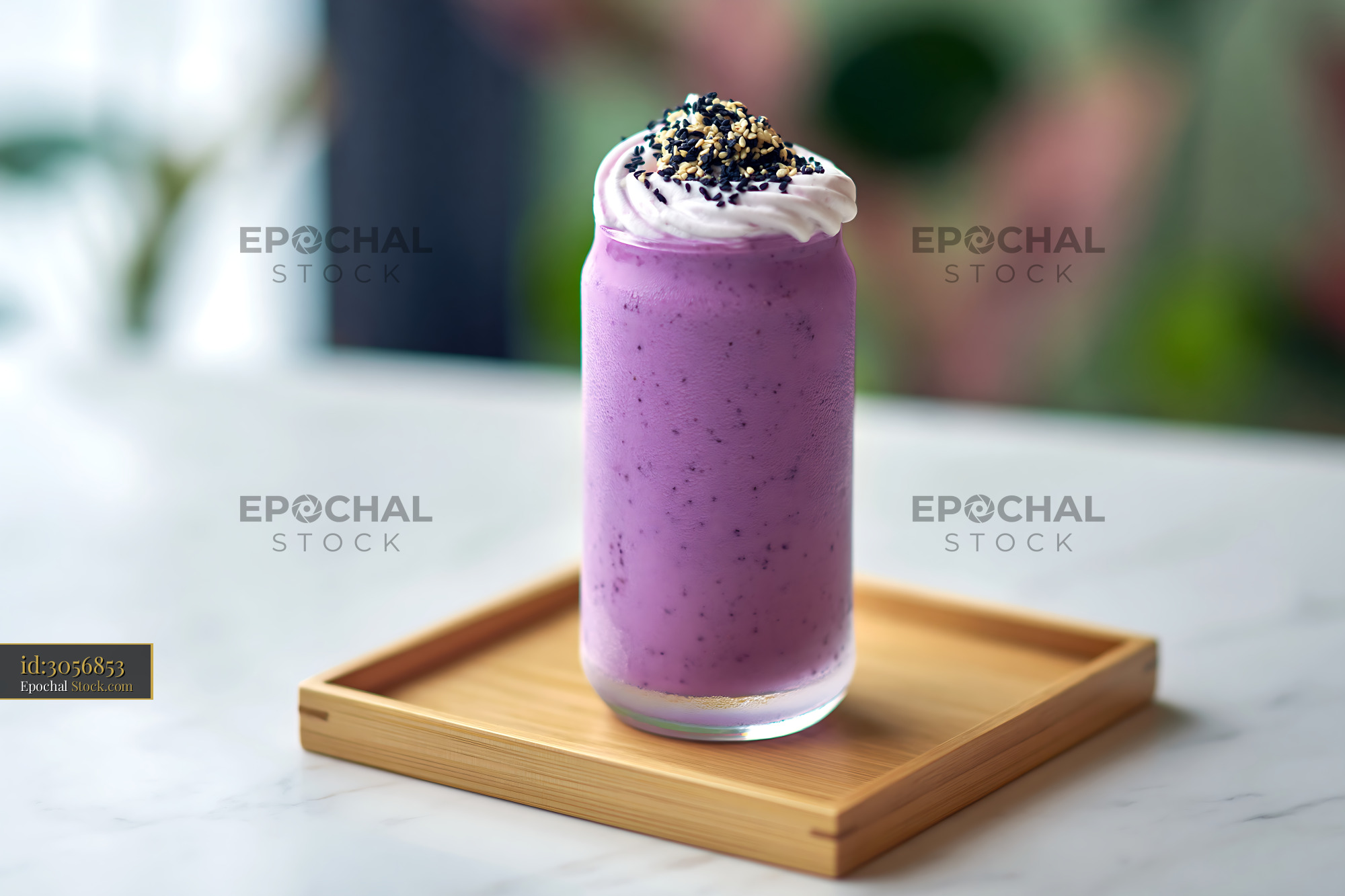 Beni imo smoothie with whipped cream and sesame seeds on wooden tray - stock photo