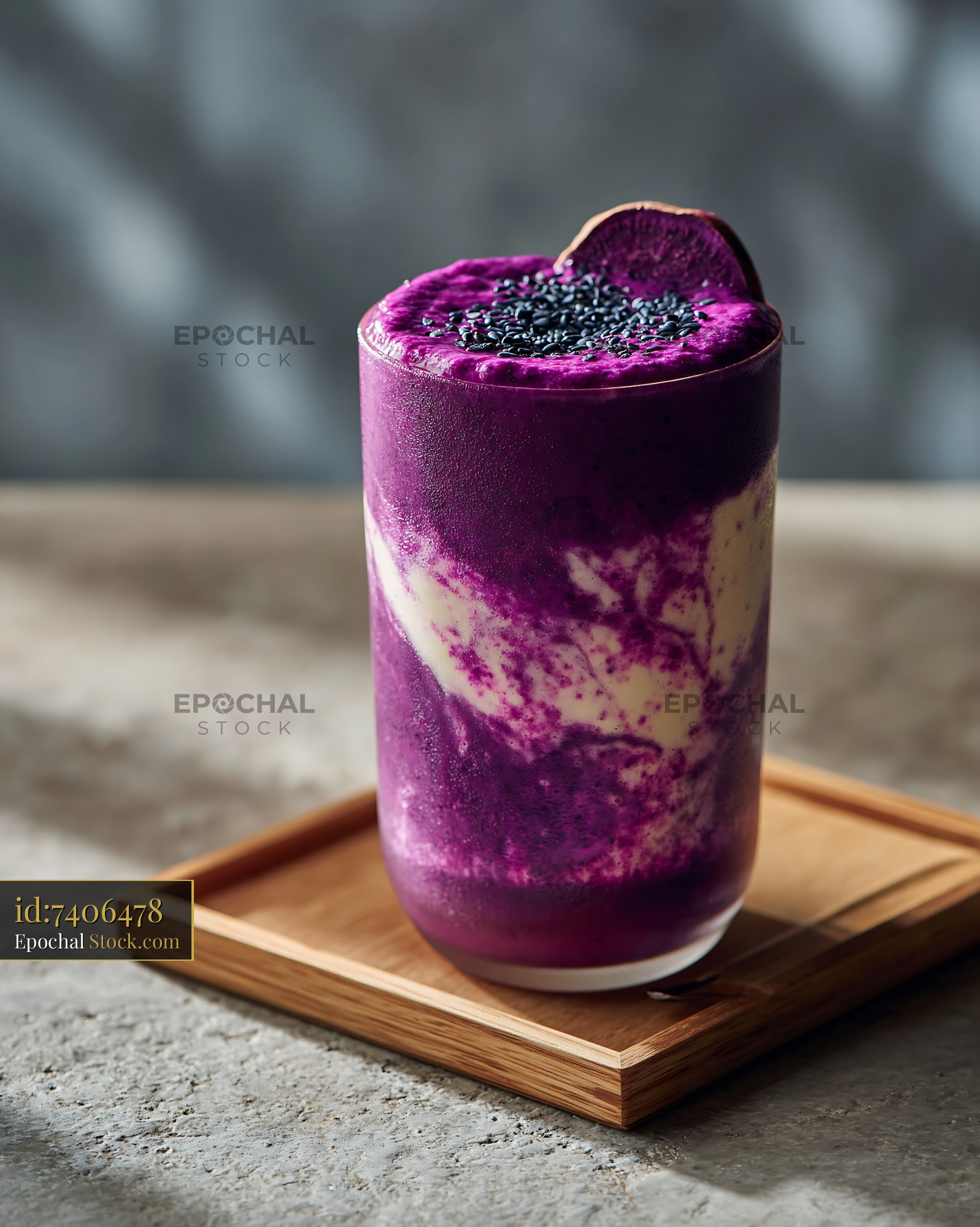Purple sweet potato smoothie with coconut swirls on a wooden tray - stock photo