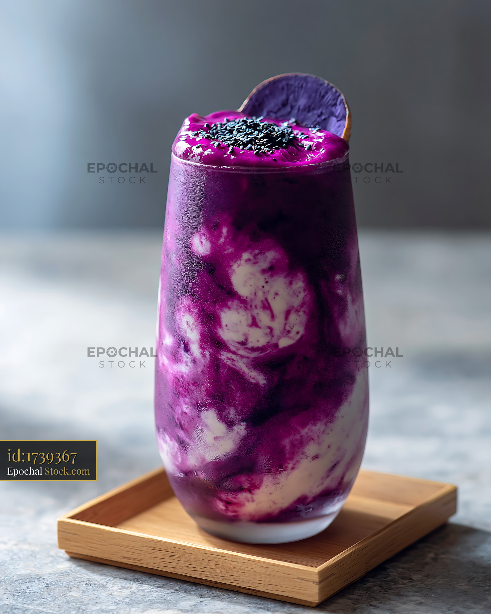 Purple sweet potato smoothie with yogurt swirls and black sesame seeds - stock photo