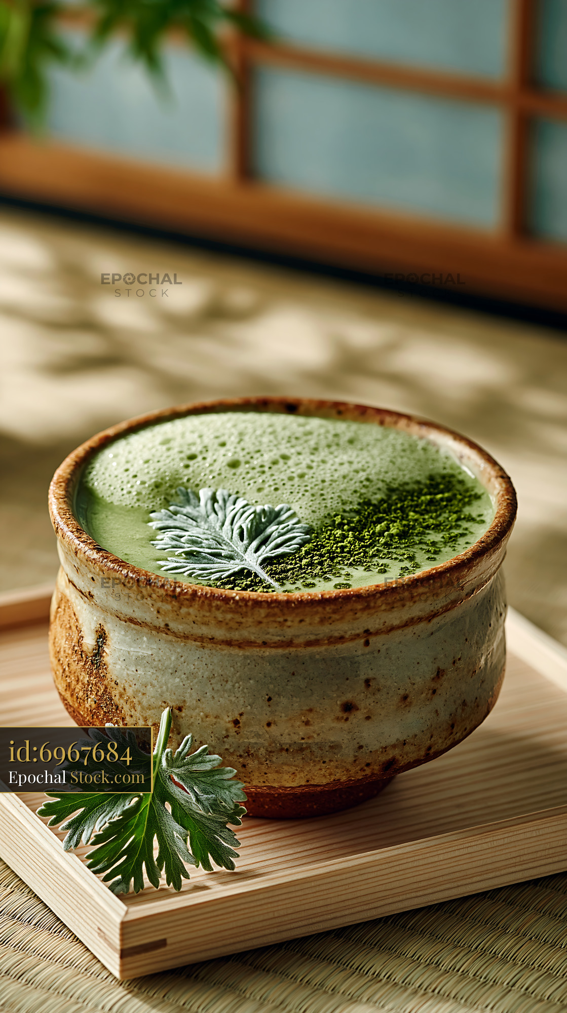 Mugwort herb smoothie in a rustic ceramic bowl on a wooden tray - stock photo