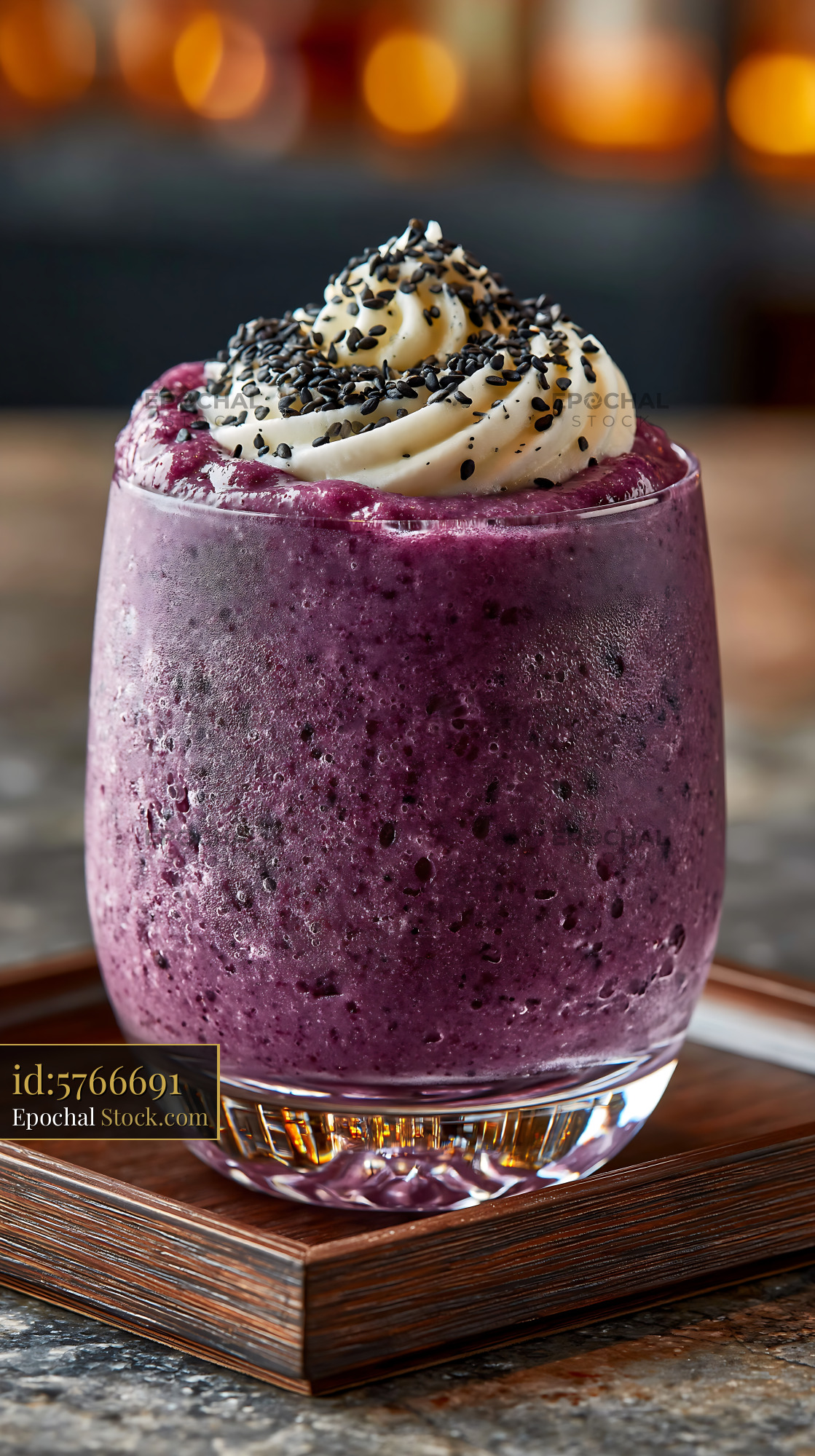 Purple sweet potato smoothie topped with cream and black sesame seeds - stock photo
