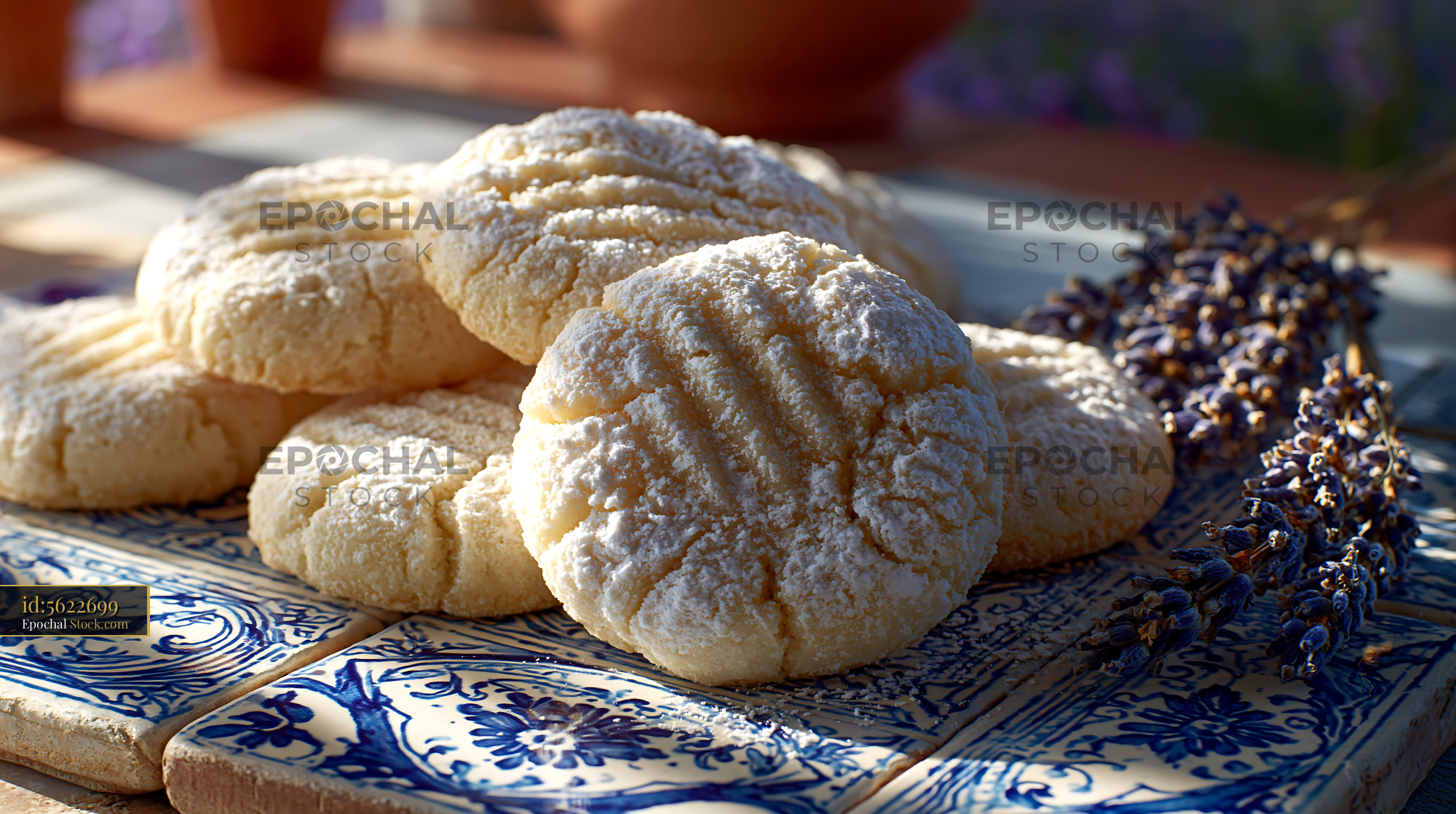Homemade un kurabiyesi biscuits with powdered sugar on blue tiles - stock photo