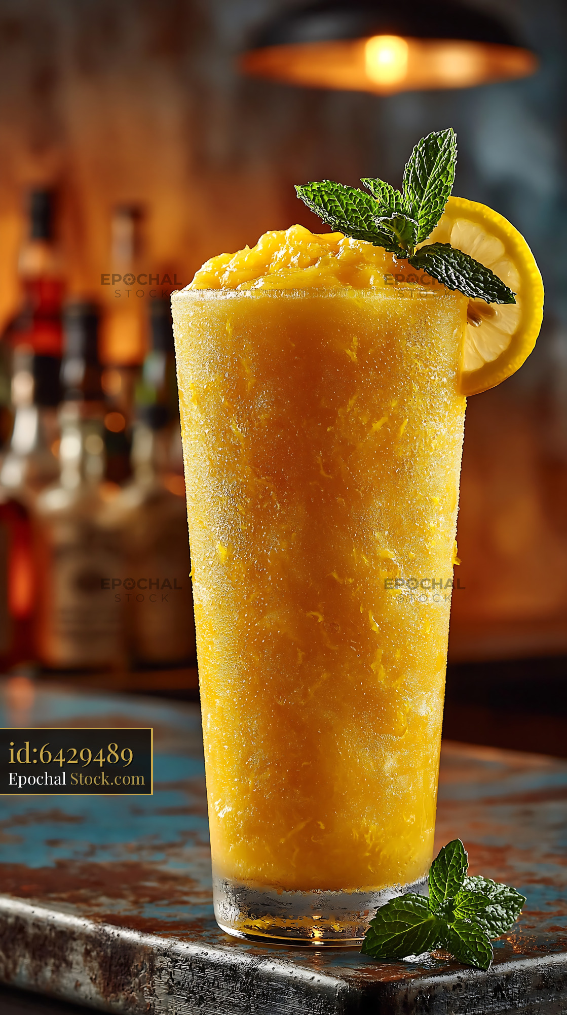 Iced yuja citron smoothie with mint and lemon in a bar - stock photo