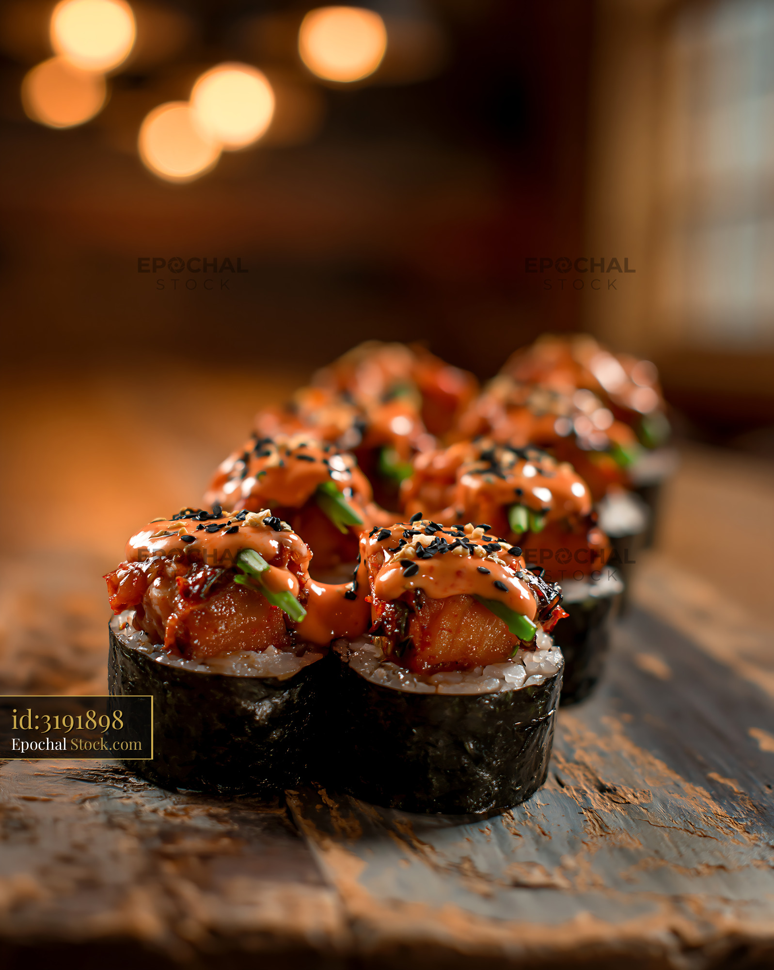 Kimchi fusion maki sushi rolls with spicy sauce in a warm restaurant - stock photo