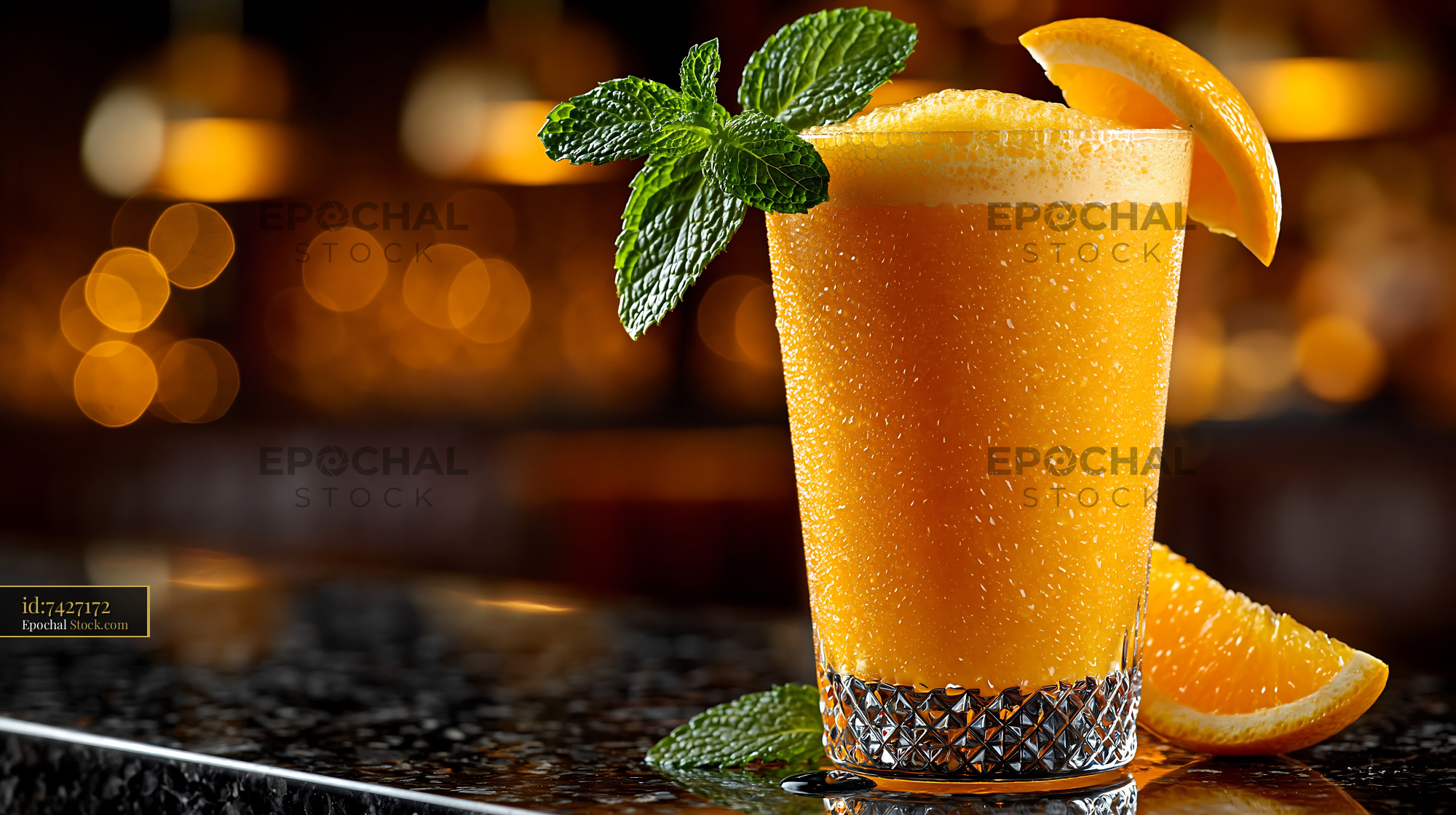 Refreshing hallabong citrus smoothie with mint on a dark bar counter - stock photo