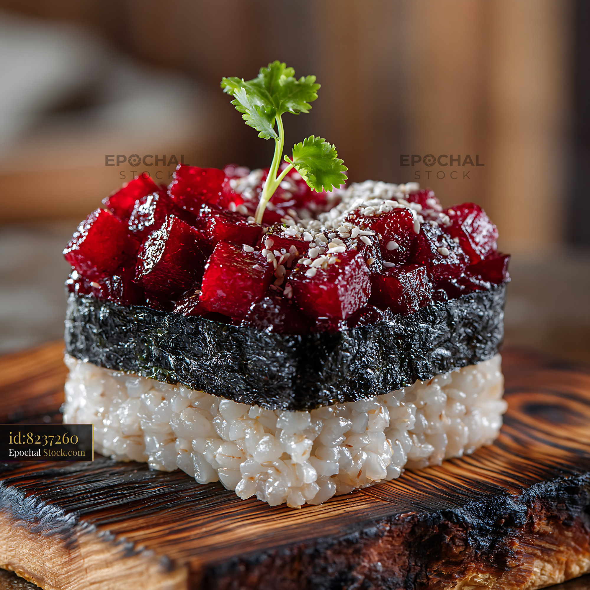 Gourmet beet tartare sushi on charred wood with cilantro garnish - stock photo