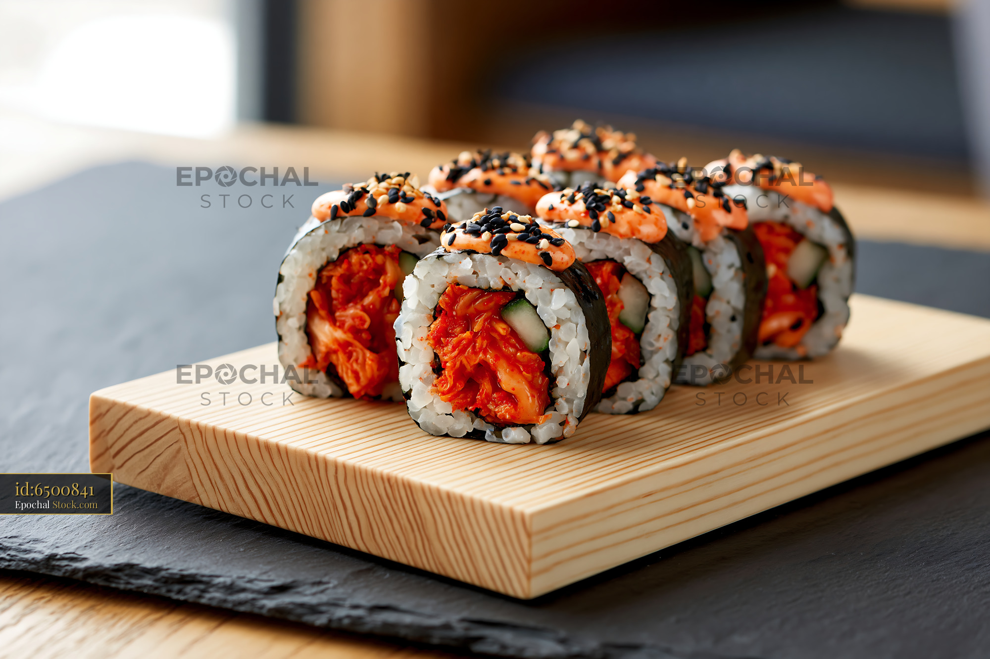 Kimchi fusion maki sushi with spicy mayo on a wooden board - stock photo