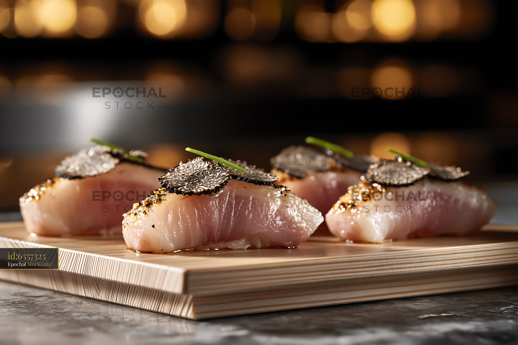 Gourmet truffle yellowtail sushi nigiri on wooden serving board - stock photo