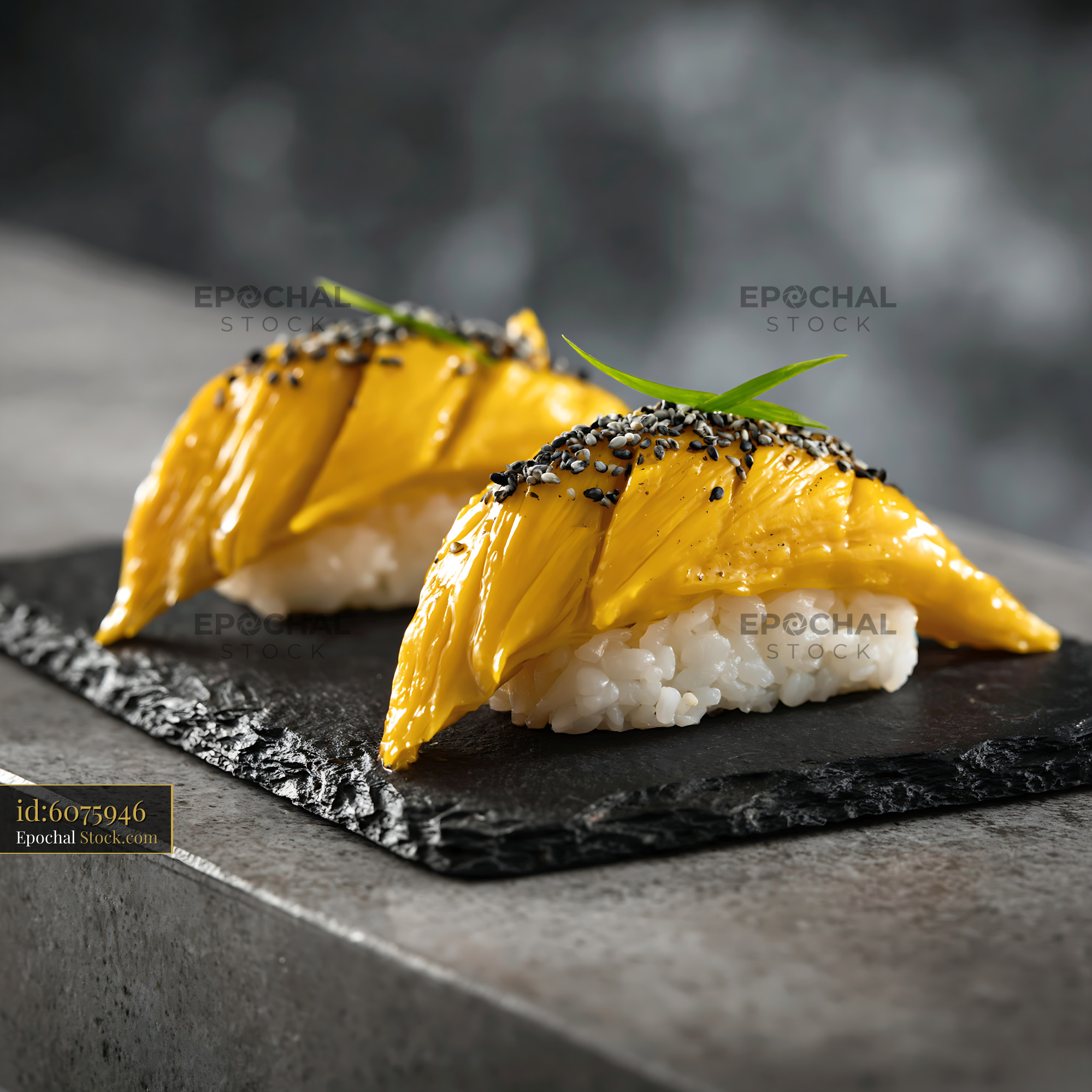 Jackfruit nigiri sushi with black sesame on a dark slate board - stock photo